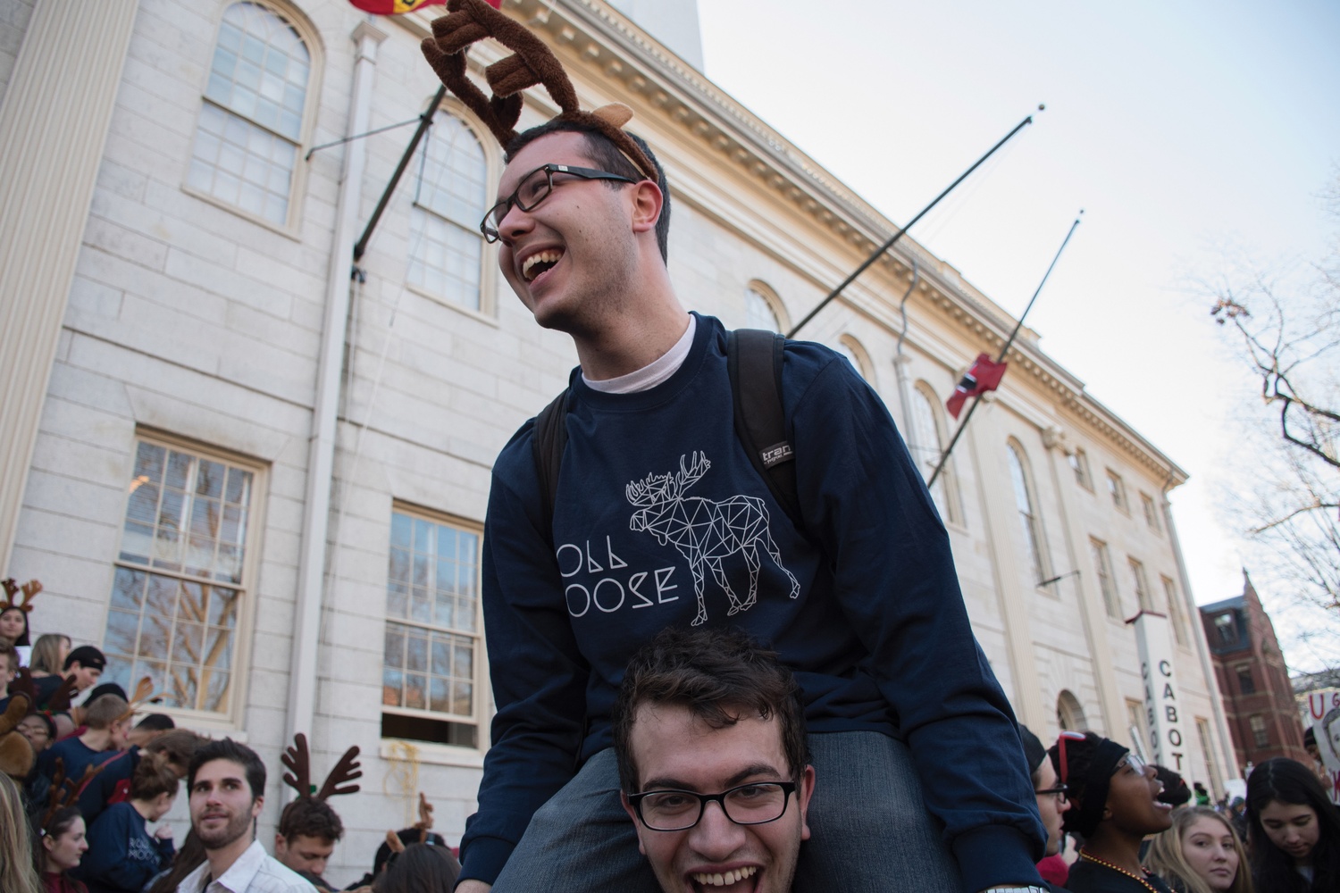Dunster resident Justin A. Dower ‘17 cheers for his House outside University Hall ahead of the freshman “dorm storming” on Thursday morning.