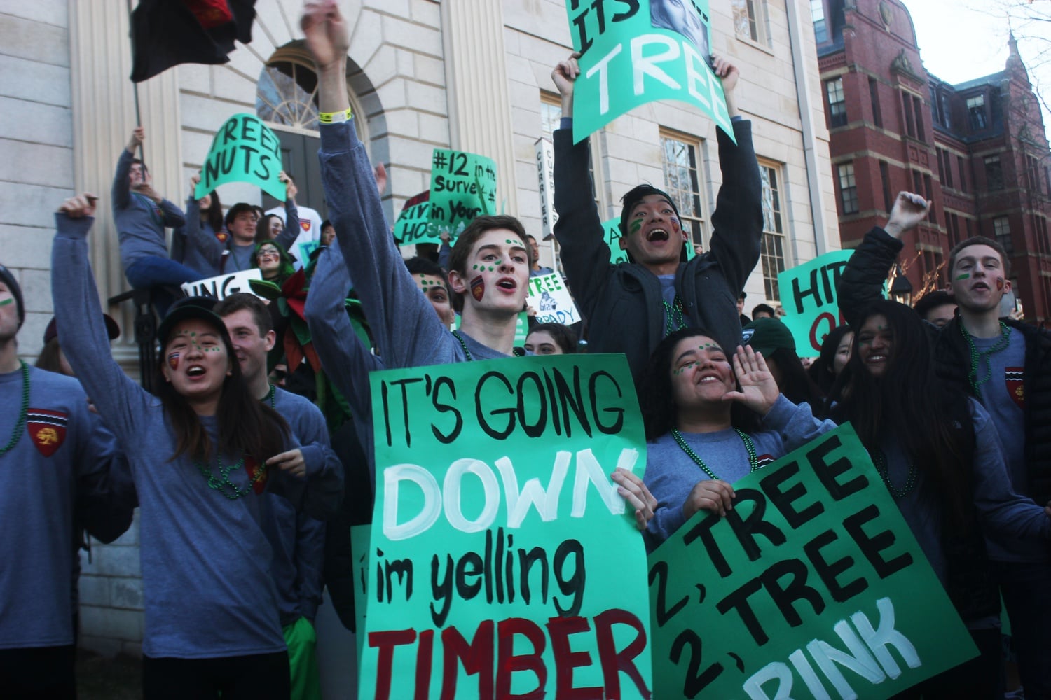 Spirited members of Currier House gather in front of University Hall on Housing Day.