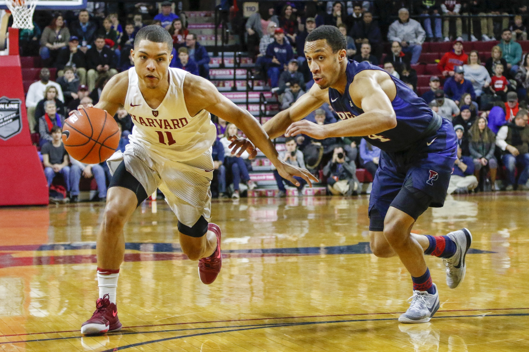 Freshman guard Bryce Aiken drives in Harvard’s Mar. 4 loss against Penn. Aiken will have an increased load next year due to the departure of senior guard Siyani Chambers as the Crimson hope for the best.
