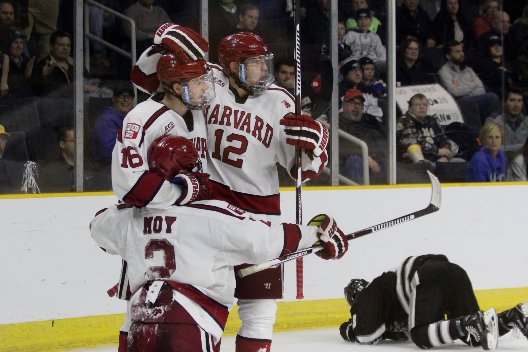 From left: Tyler Moy, Ryan Donato, and John Marino celebrate Harvard's third and final goal against Providence. For the first time in 23 years, the Crimson will advance to a second NCAA tournament game tomorrow evening.