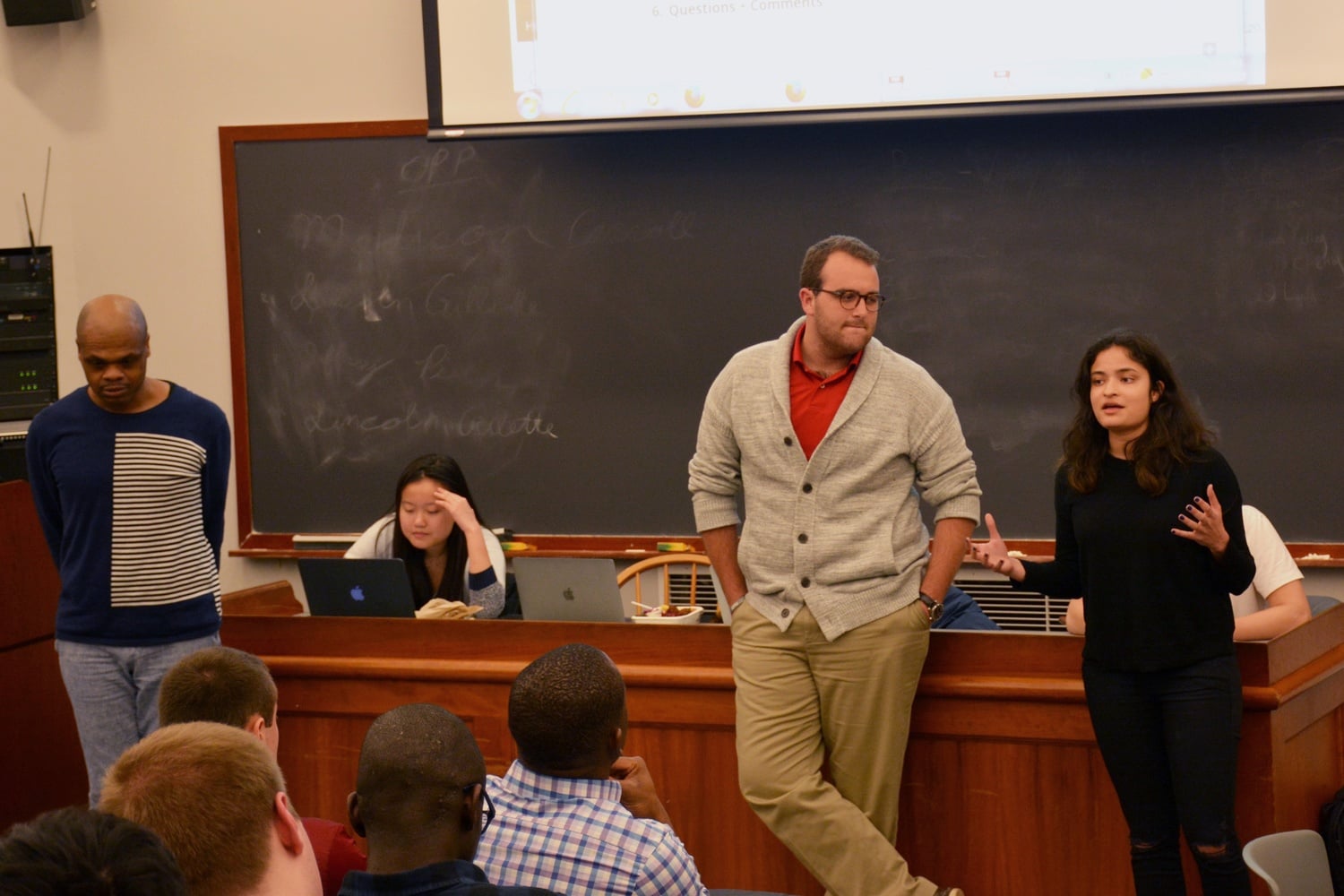 Yasmin Z. Sachee ’18 and Cameron K. Khansarinia ’18 discuss the new student organization recognition process at the Undergraduate Council General Meeting Sunday evening.