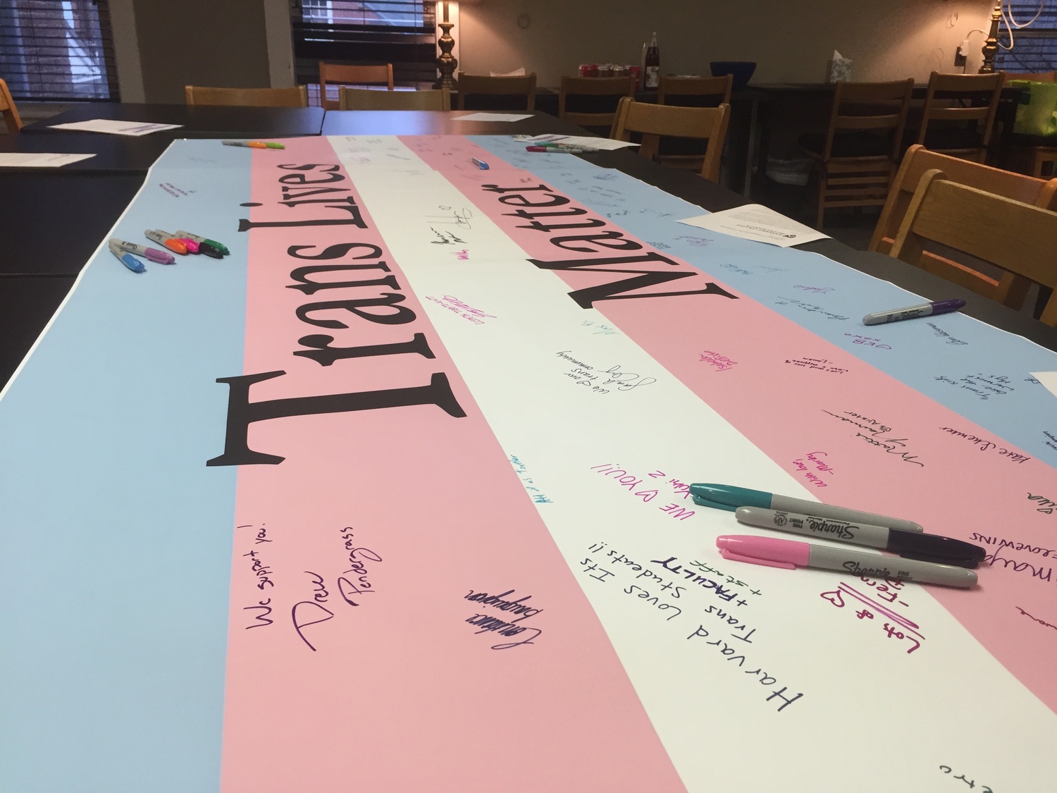 Ahead of an anti-transgender "Free Speech Bus" scheduled to be on campus Thursday, the Office of BGLTQ Student Life hosted a "Trans Lives Matter" banner signing event Tuesday afternoon.