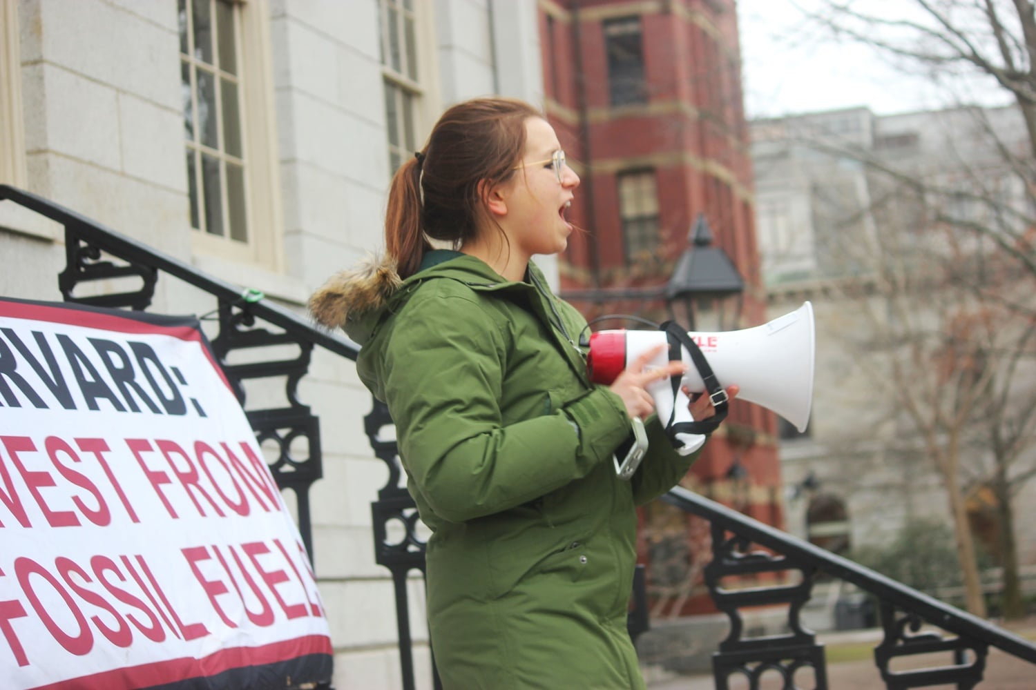 Isa C. Flores-Jones ’19 speaks in front of University Hall during Divest Harvard’s rally on Wednesday afternoon. Divest Harvard members blockaded the doors to the administrative building as a part of their protest to pressure Harvard to divest university endowment from coal and fossil fuel companies.