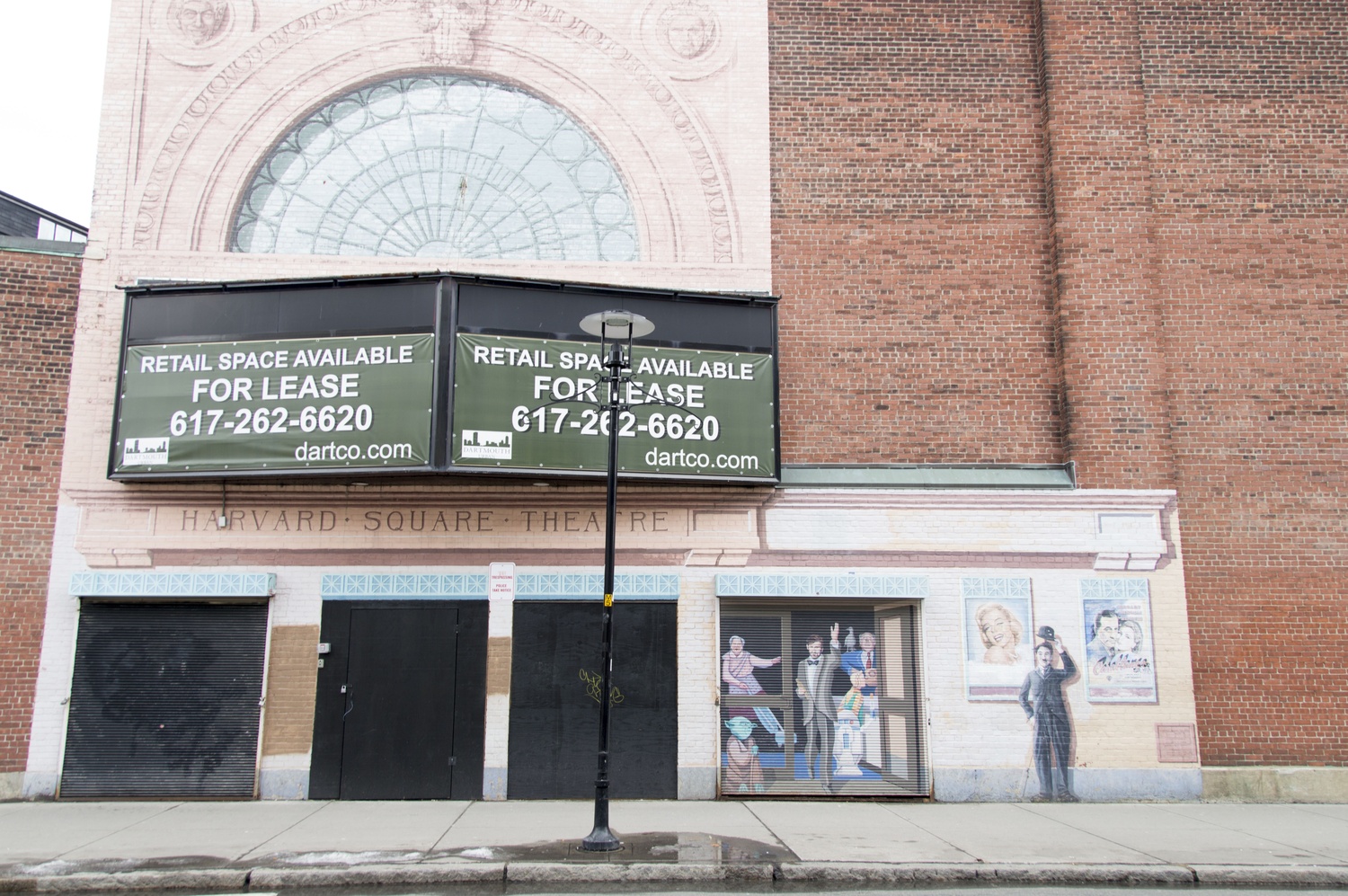 The Harvard Square Theater on Church Street advertises leasing. The brick building remains vacant years after its closing, prompting the Cambridge City Council to look into the owner’s plans for its redevelopment. 