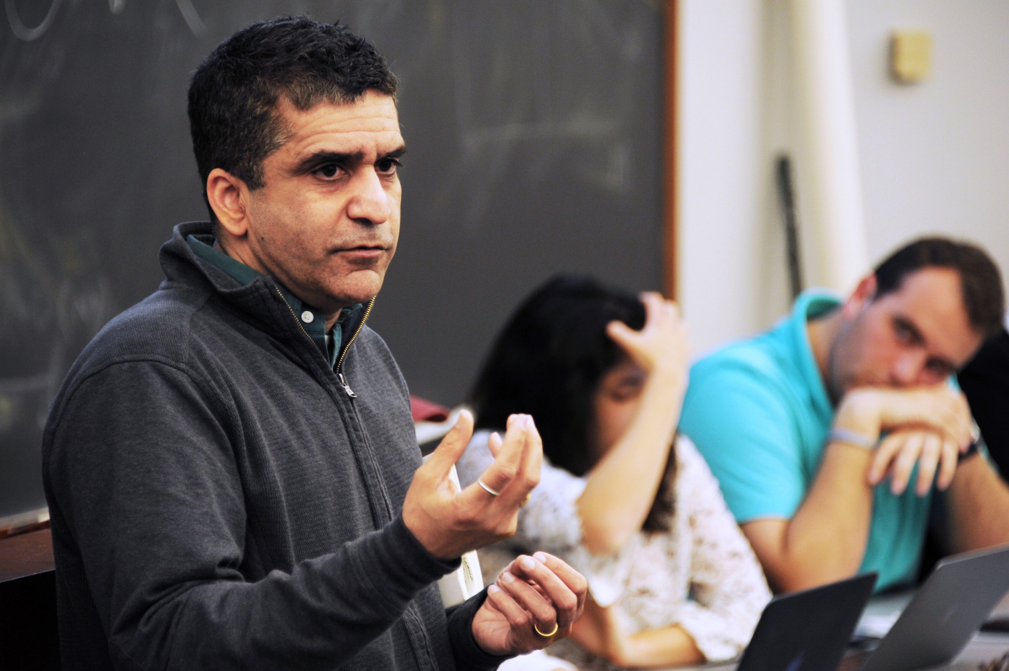 Dean of the College Rakesh Khurana speaks at an Undergraduate Council meeting in Harvard Hall on Sunday evening. During the meeting, Khurana explained why he rejected a proposed summer program for low-income and first generation students.