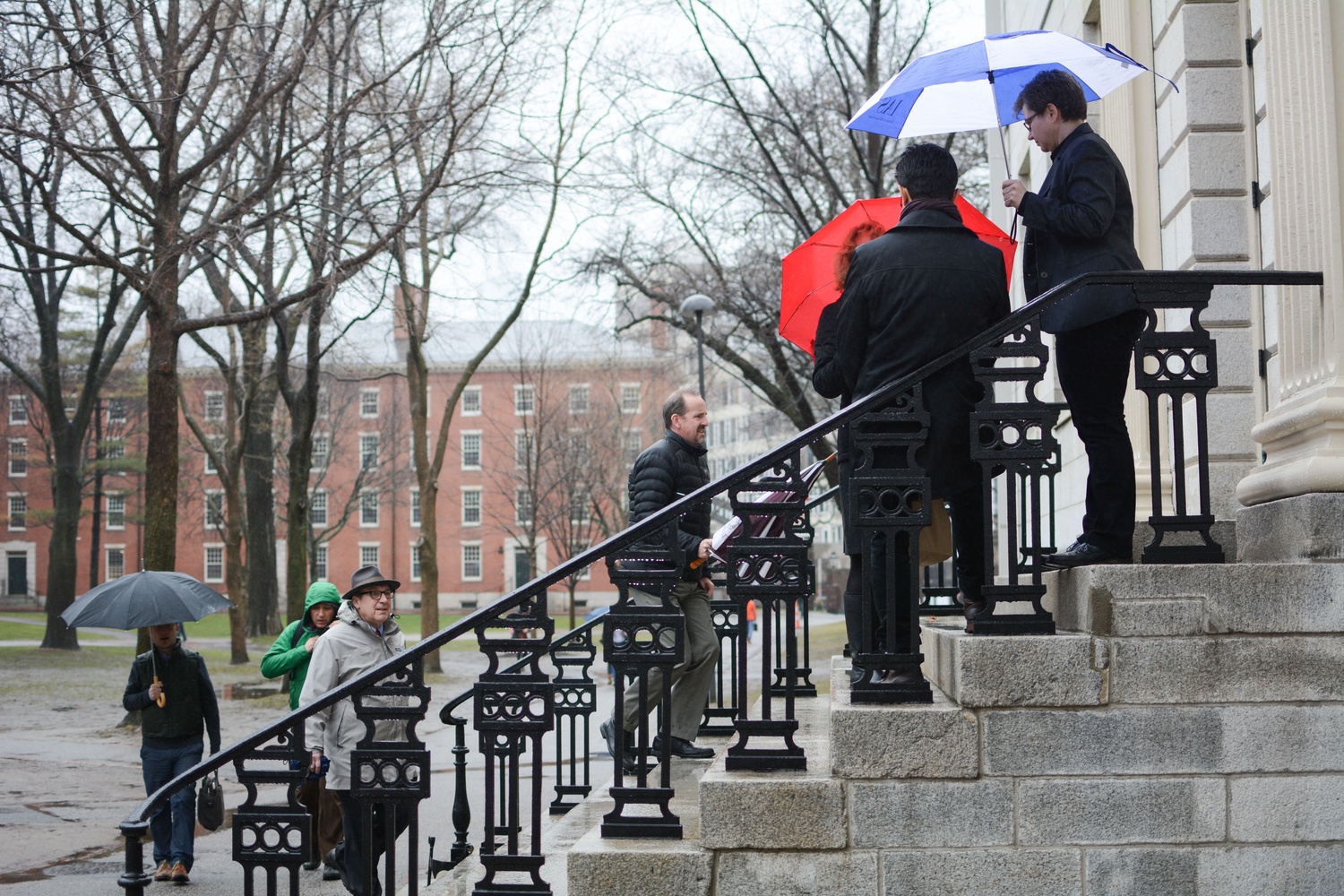 SEAS Dean Frank Doyle and Computer Science professor and former Dean of the College Harry R. Lewis '68 enter University Hall for the Faculty meeting in April.