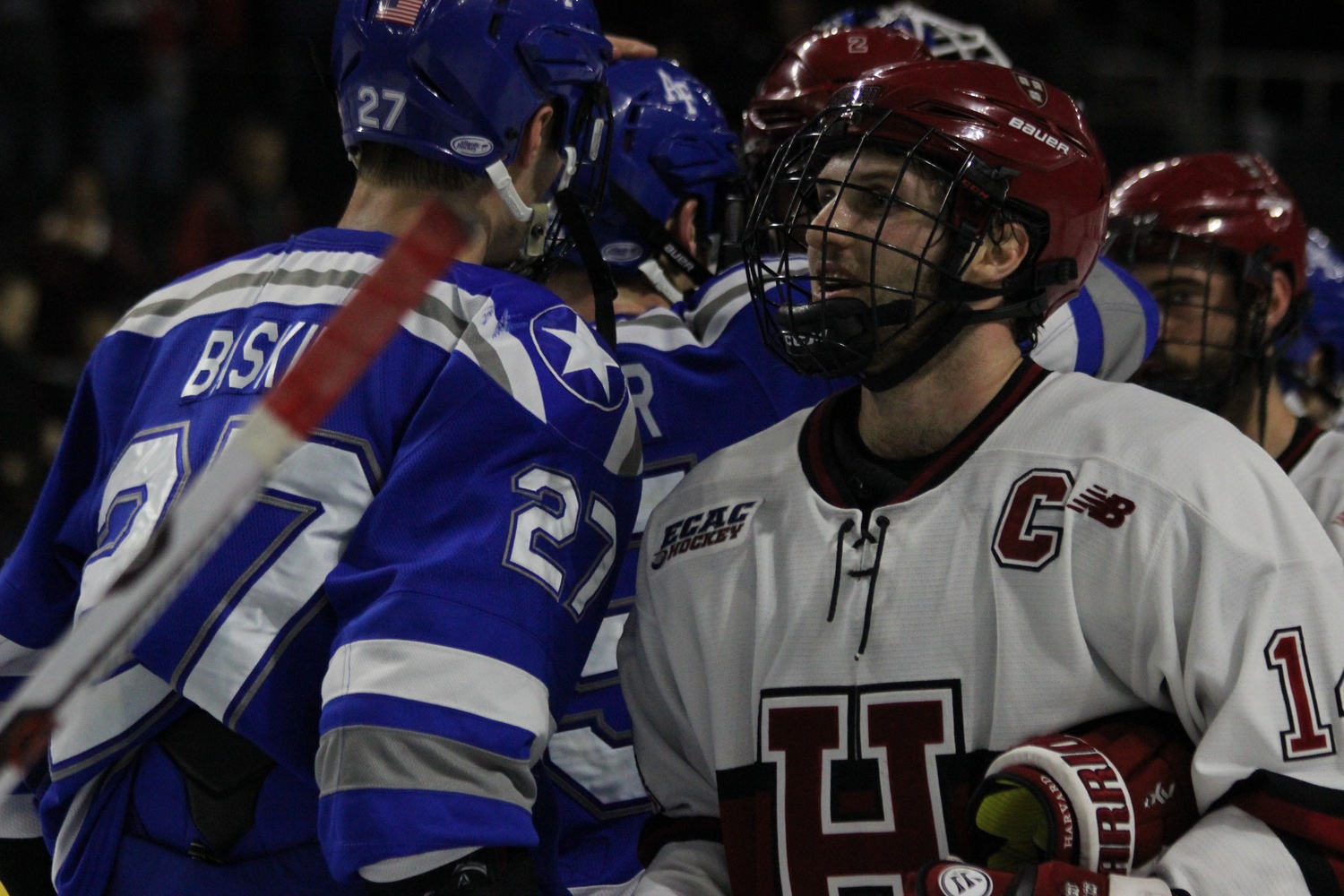 Alexander Kerfoot makes his way through the handshake line after Harvard's 3-2 win over Air Force in the East Regional.