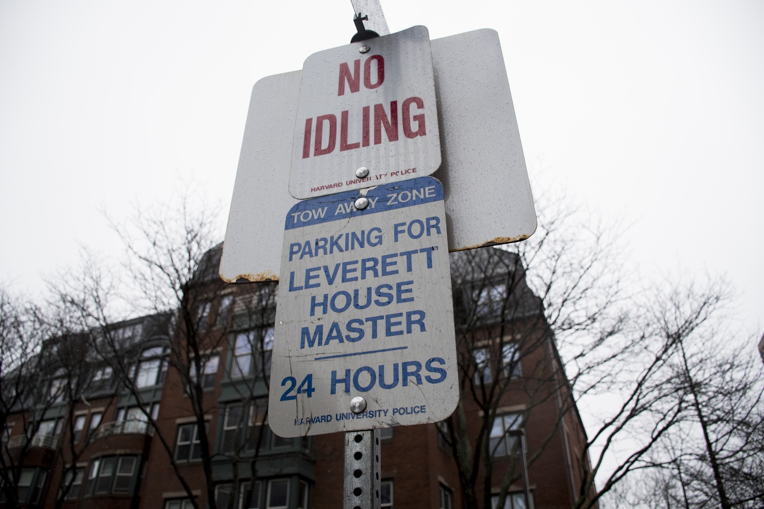 A designated parking sign outside Leverett House’s McKinlock Hall reads 'House Masters' more than a year after the position was renamed 'Faculty Deans'.