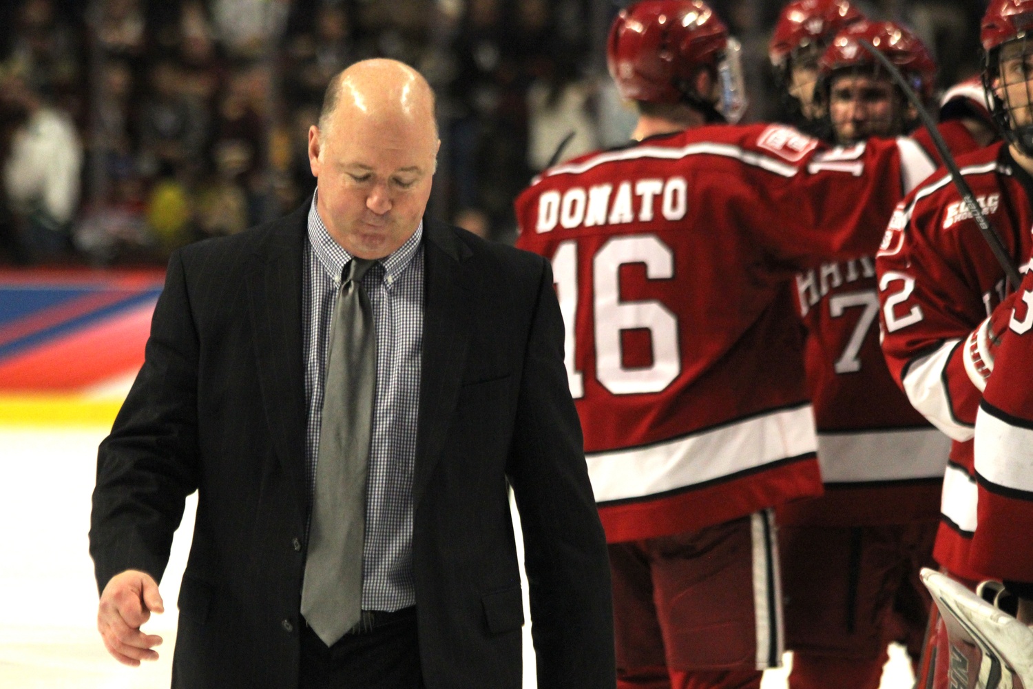 Coach Ted Donato '91 leaves the ice following Thursday evening's 2-1 loss to Minnesota-Duluth in Harvard's first Frozen Four appearance since 1994.