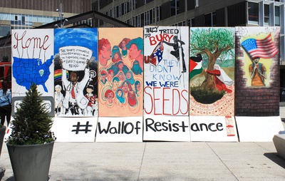 Cover image for Activists, Artists Build 'Wall of Resistance' in Science Center Plaza