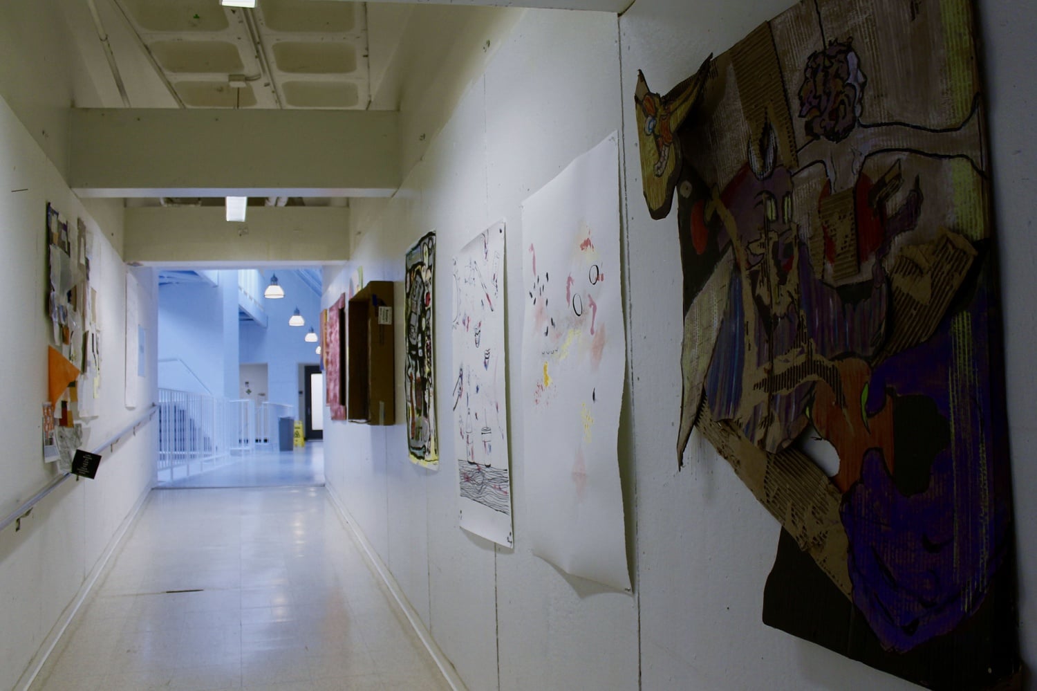 Student art hangs in the halls of the SMFA in Boston, where students can pursue undergraduate and graduate studies in arts.