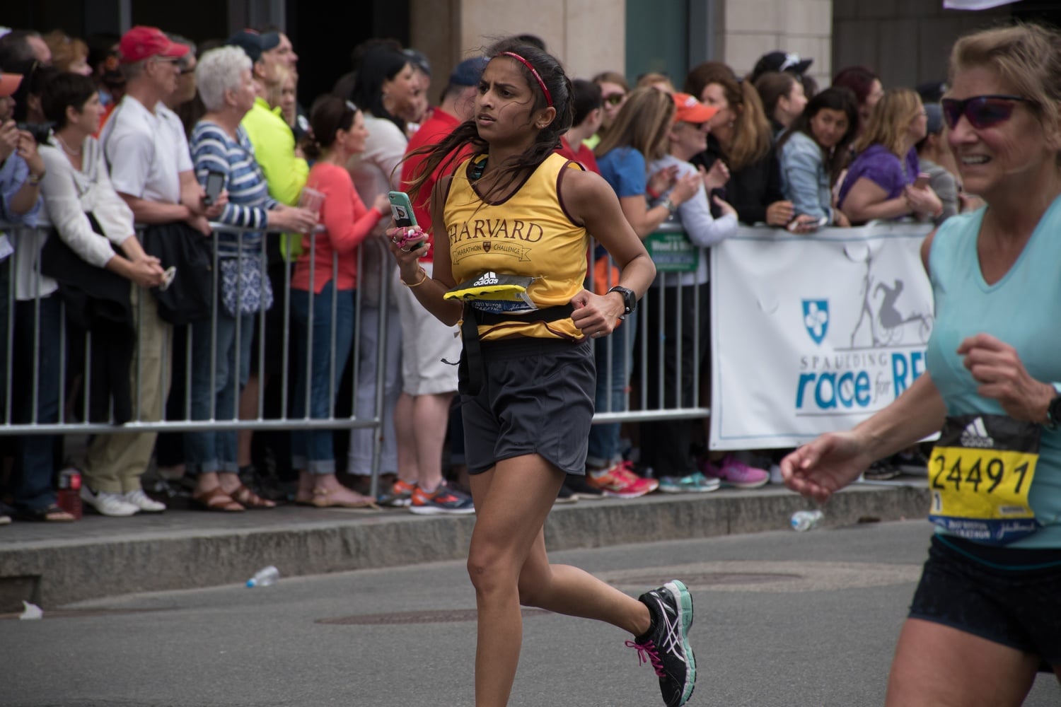 Kruti B. Vora '17, a member of the Harvard College Marathon Challenge, reaches the home stretch of the Boston Marathon on Monday afternoon.  Vora was one of several Harvard undergraduates who ran the marathon to benefit the Phillips Brooks House Association.