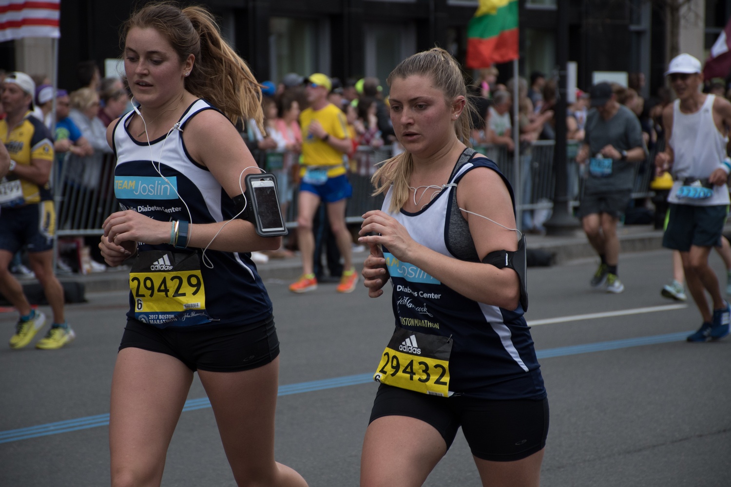 Adrian E. Horton '16-'17 (right) runs with her sister Elena in the Boston Marathon on Monday.