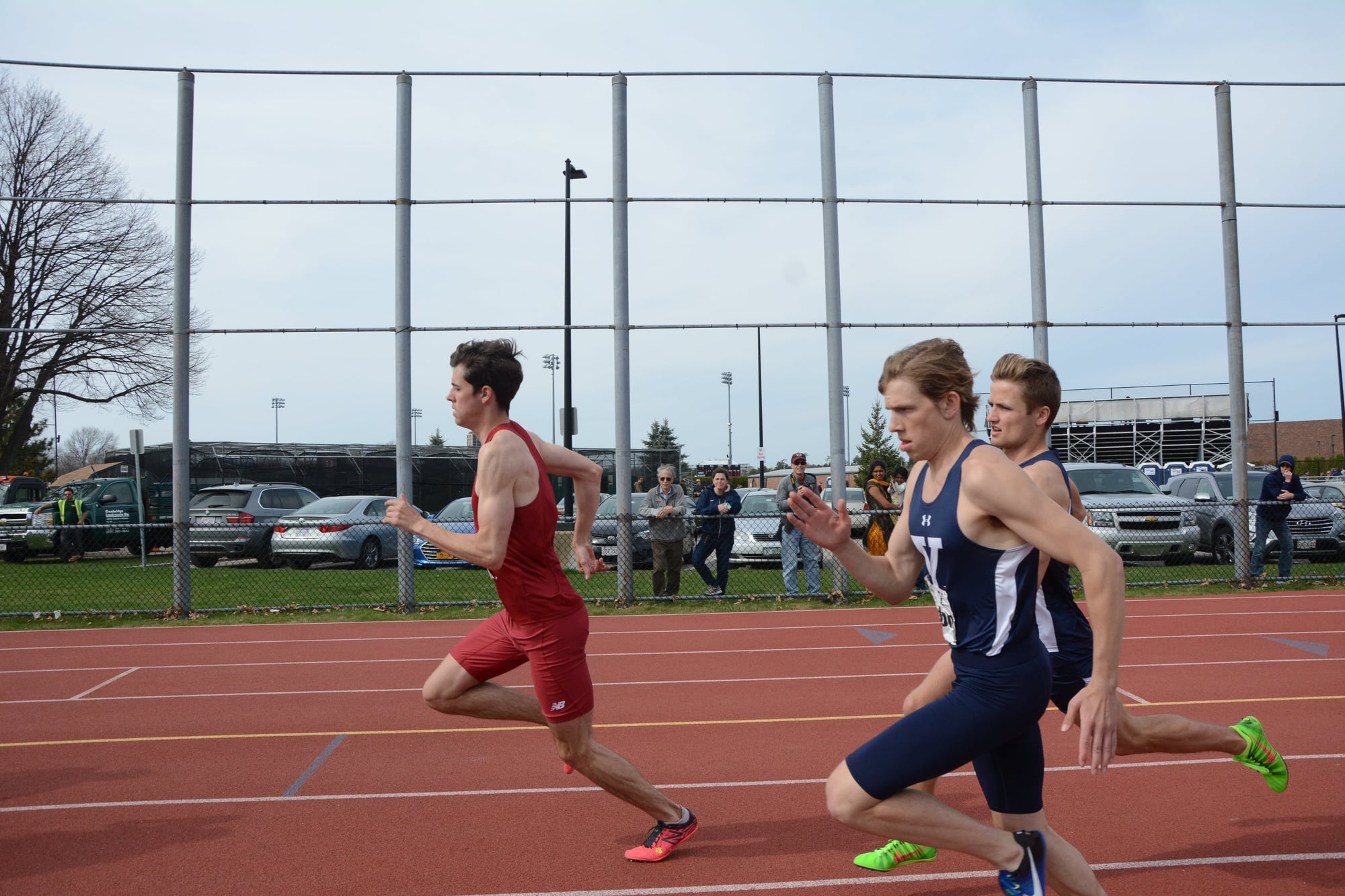 Senior Thomas Negron outpaces two Yale racers in the Harvard-Yale meet earlier this season. At the Outdoor Heps, the men’s team put on its best showing since 2014, racking up a total of 85 points.