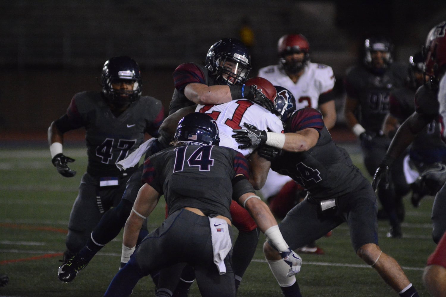 The Penn defense swallows up sophomore running back Charlie Booker. The Quakers emerged victorious, 27-14.