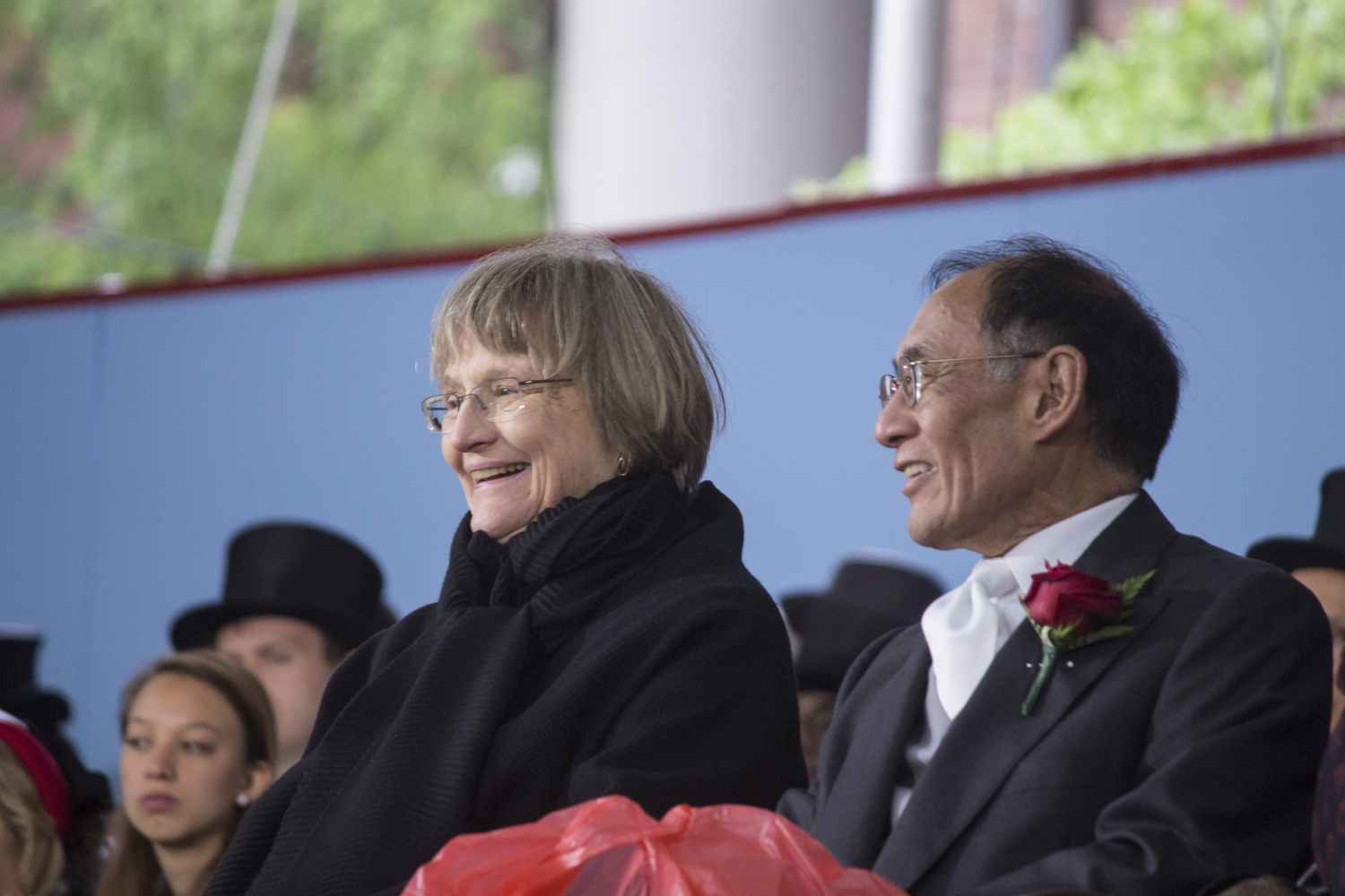 University President Drew G. Faust and Corporation member William F. Lee '72 share a laugh during a Harvard Alumni Association Meeting in the Tercentenary Theatre.