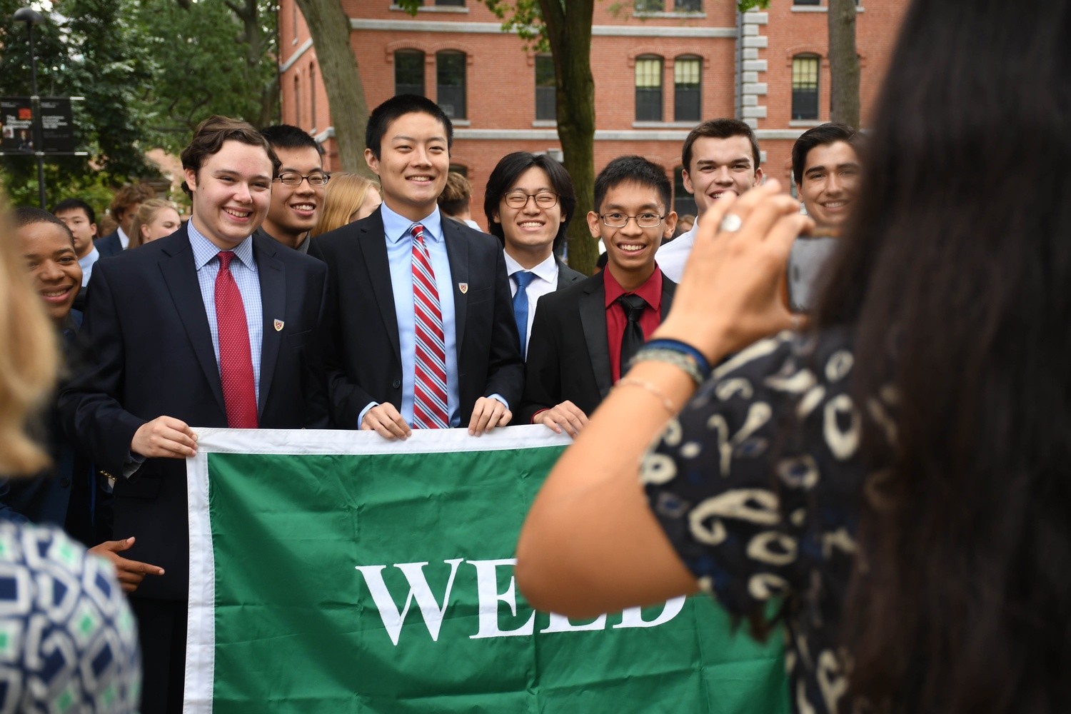 Weld residents pose for a photo in Harvard Yard ahead of their Freshman Convocation on Tuesday.