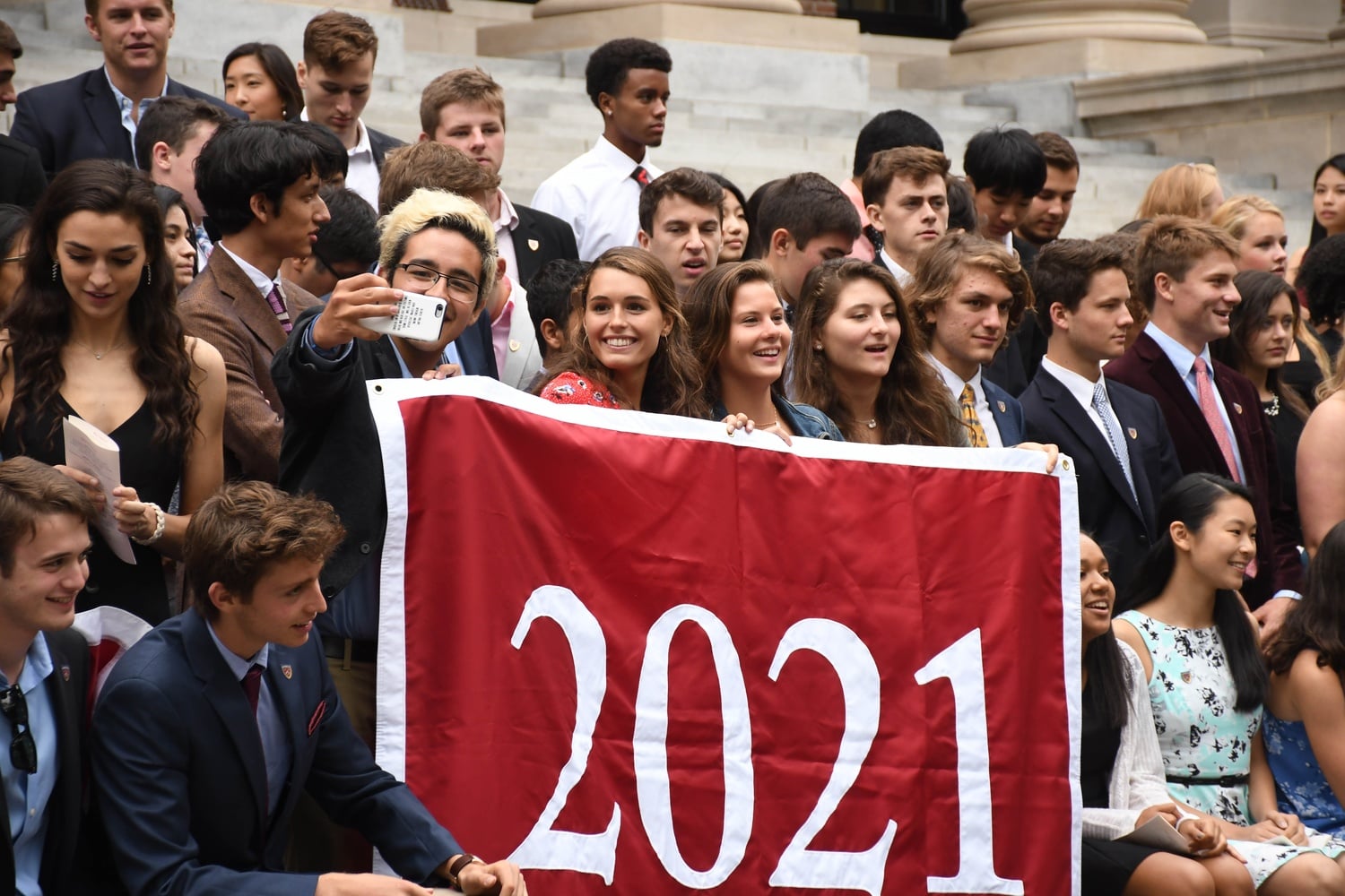Members of the Class of 2021 gather for their class photo following Freshman Convocation.