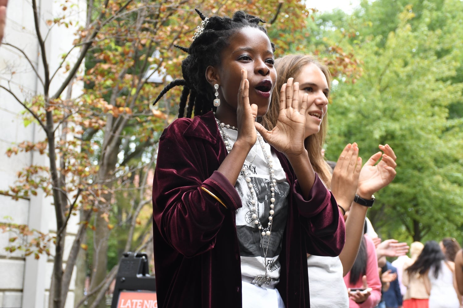 Amanda S. C. Gorman '20, a Peer Advising Fellow in Weld 4/5 entryway, cheers as freshmen process into their Convocation on Tuesday.