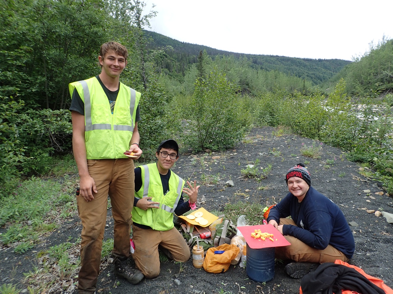 Jack Conseco, center, helping prepare a meal.