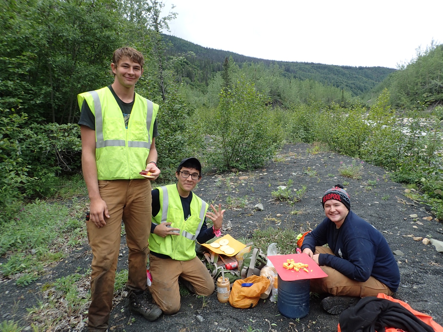 Jack Conseco, center, helping prepare a meal.