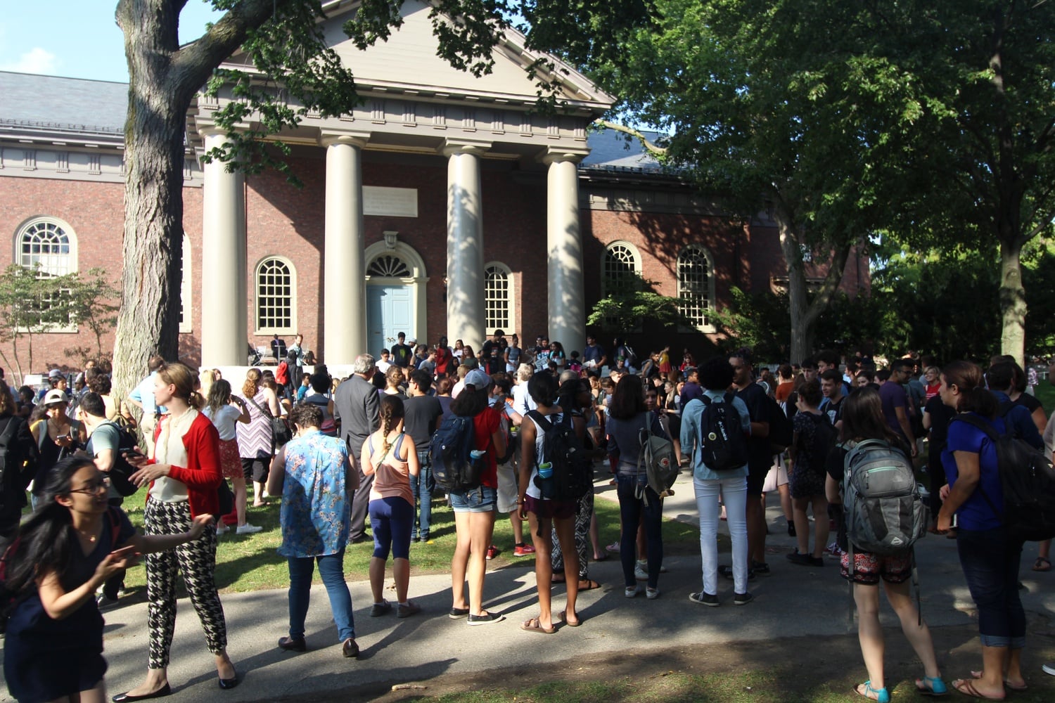 A crowd looks on as students speak at the Fight for Immigrant Rights rally Tuesday afternoon. The rally was organized by Harvard College Act on a Dream and other student groups.
