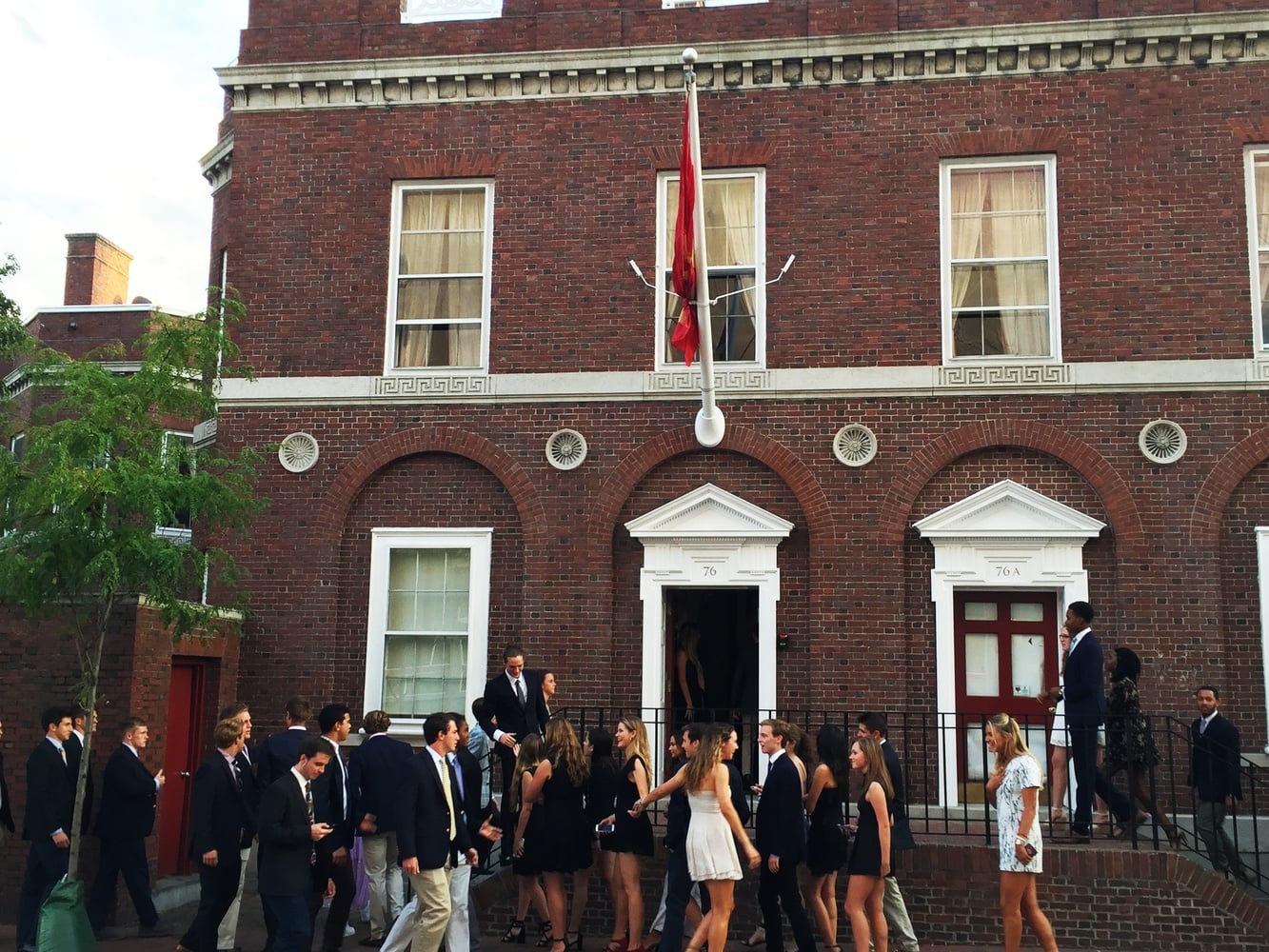 Sophomore men and women stand outside the clubhouse of the Spee Wednesday evening, before the group's first punch event.