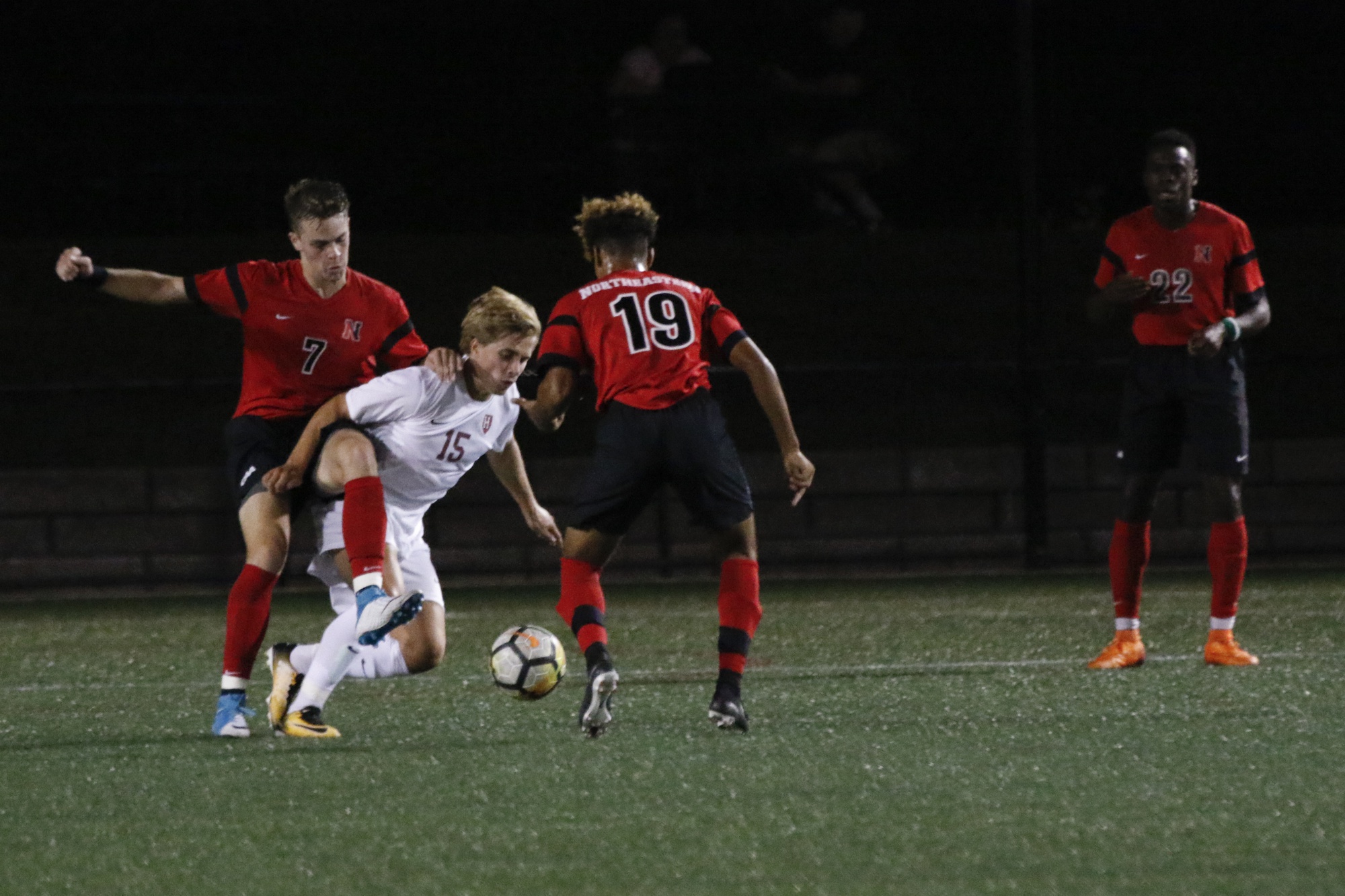Freshman midfielder Cornelius Bencsik challenges for the ball in previous action against Northeastern. The Norwegian rookie made his first career start for the Crimson.