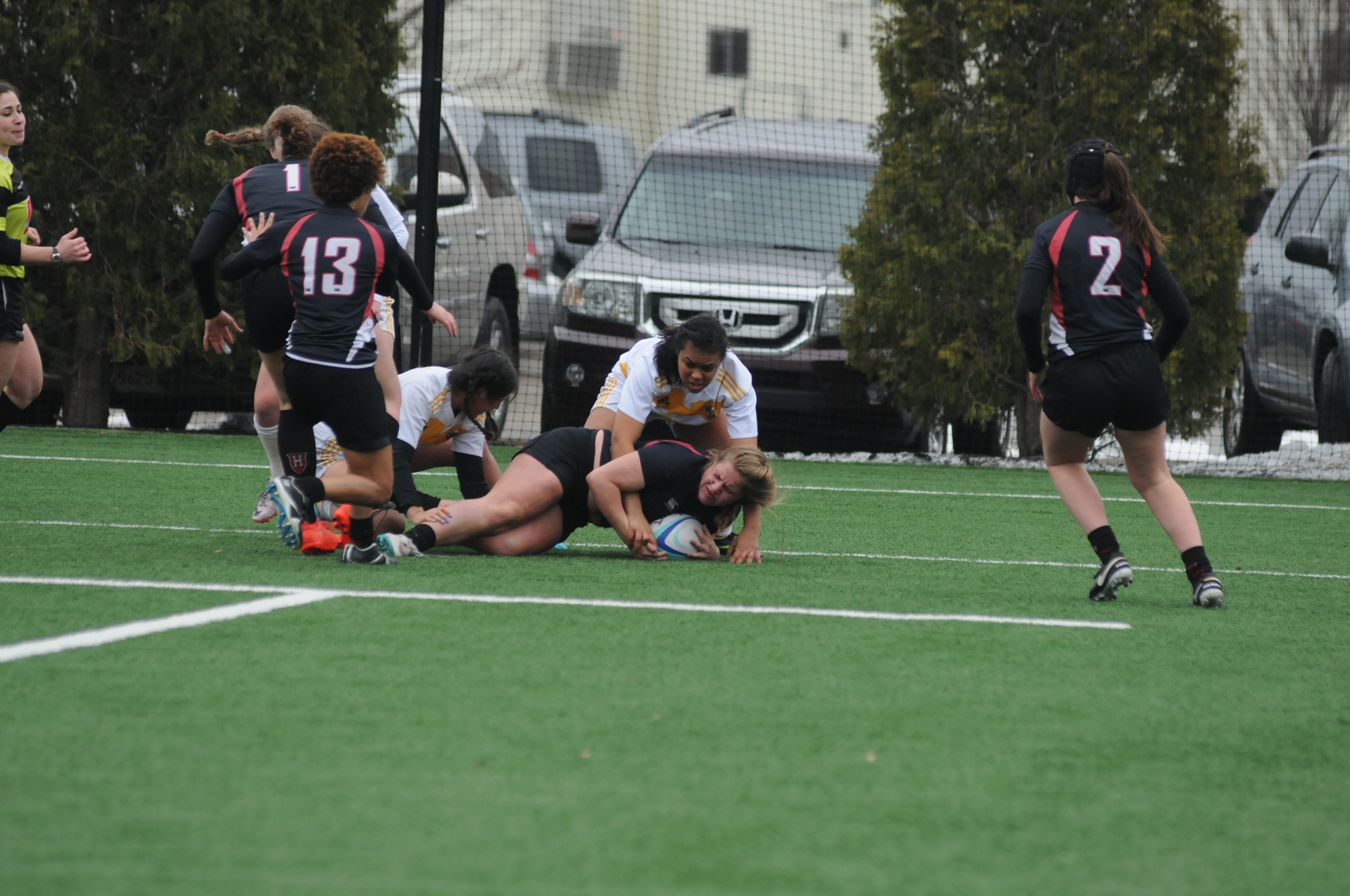 The Crimson fights for the ball in previous action against AIC. Against Army, Harvard scored 33 points in a split match effort.