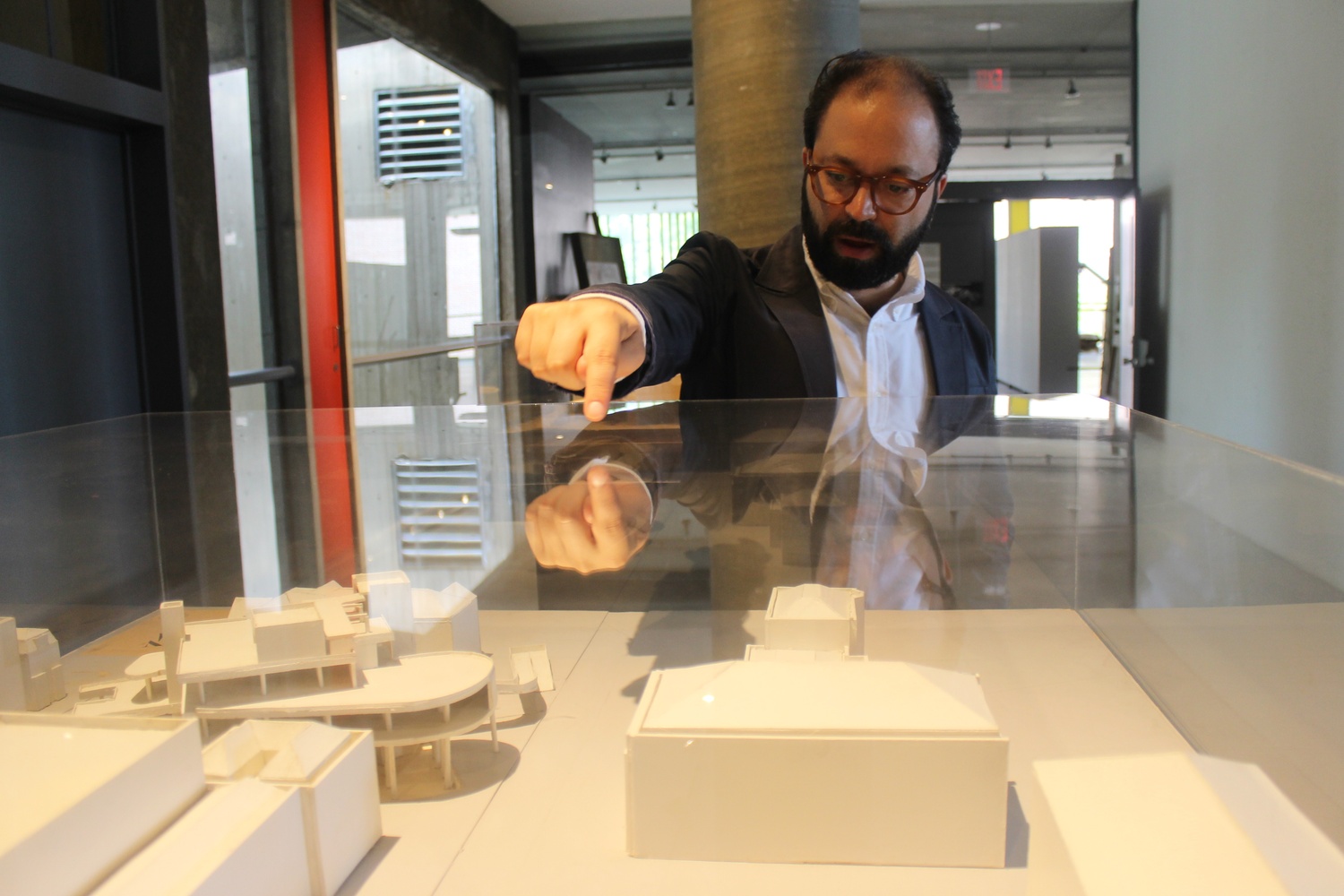 Dan Byers points out locations on a scaled model of the Carpenter Center constructed in the 1960's. Byers has recently become Director of the Carpenter Center for the Visual Arts, coming to Harvard from The Institute of Contemporary Arts/Boston.