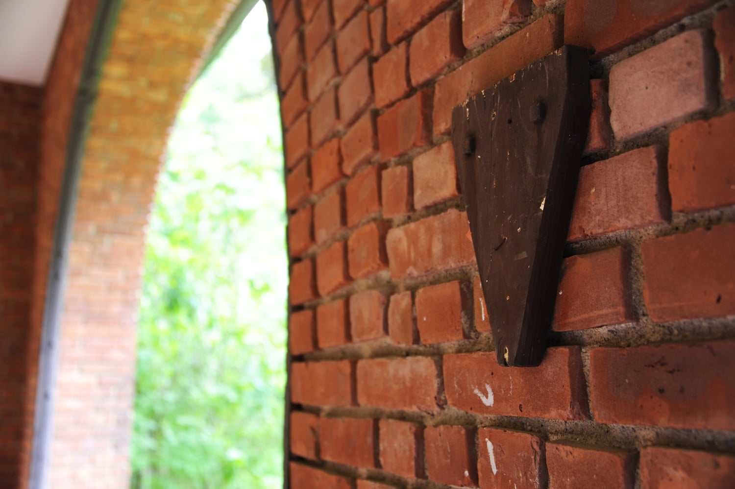 A blank wooden crest remains on the wall of Agard House. The residential hall used to house the Delta Phi Fraternity at Williams.