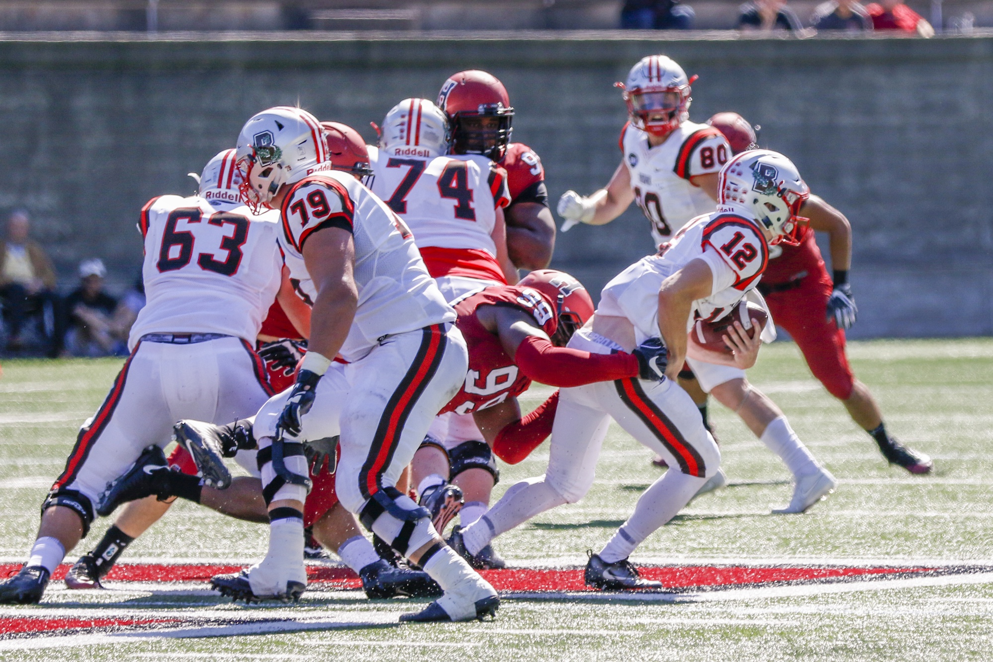 Junior defensive lineman D.J. Bailey takes down quarterback Nicholas Duncan. Collectively, Harvard held Brown to nine rushing yards in the first half.