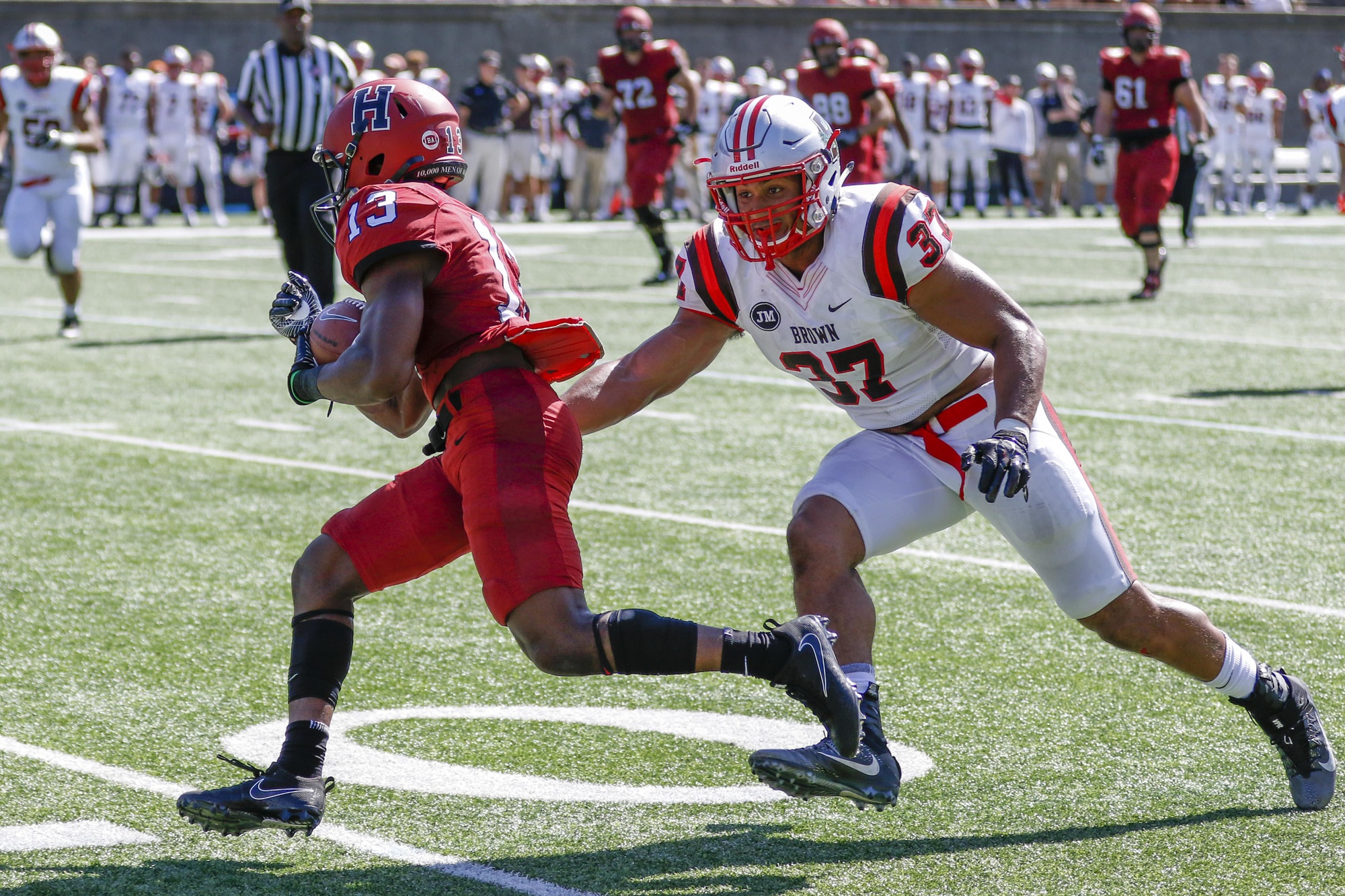 Junior wide receiver Adam Scott aims to evade a tackle. He led Harvard with 79 receiving yards on five catches.