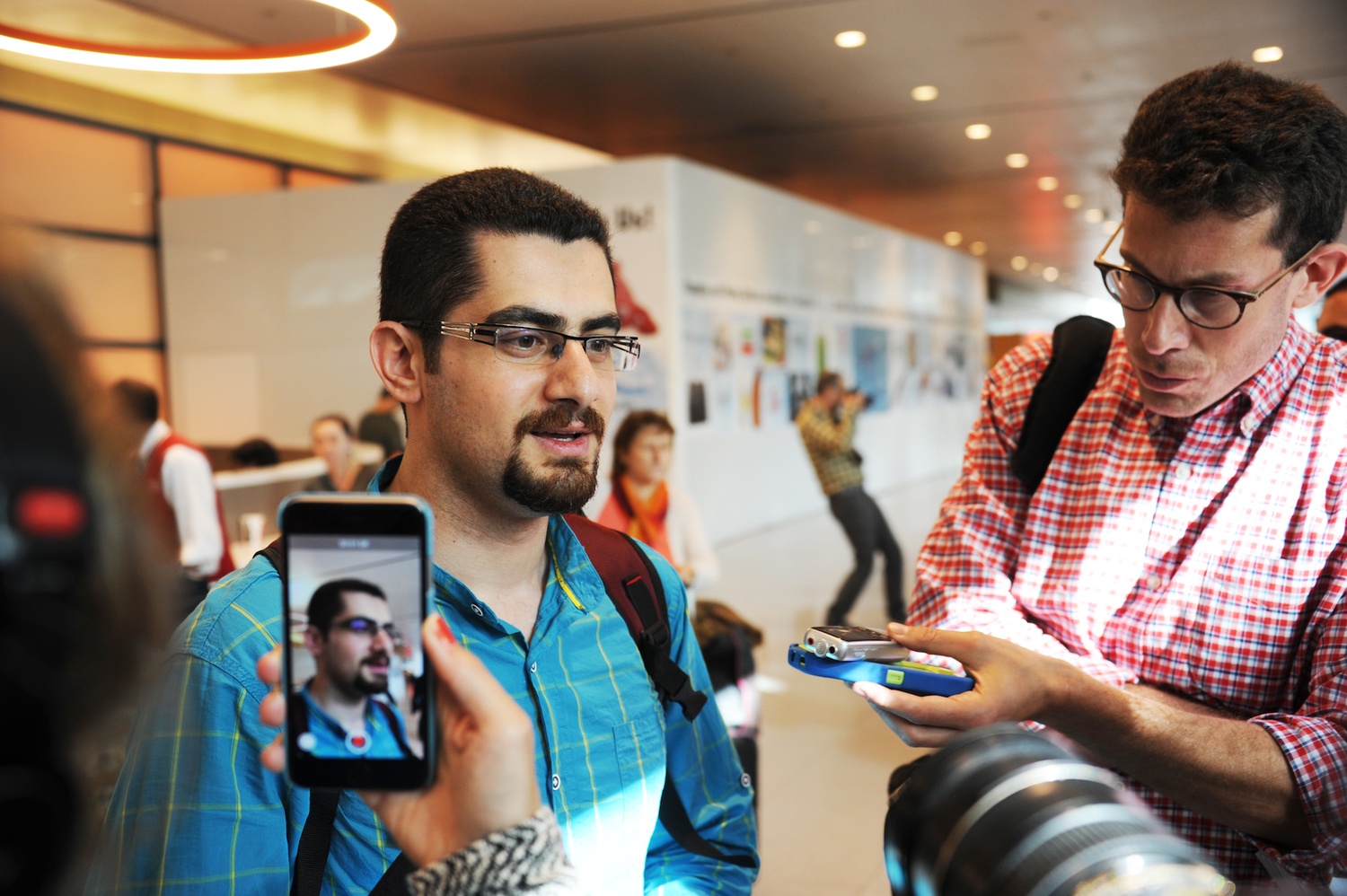 Iranian scientist Seyed S. S. Saravi speaks to the press after arriving at Boston Logan International Airport Wednesday afternoon. Saravi was barred from researching at Harvard for eight months by President Donald Trump’s first immigration ban.