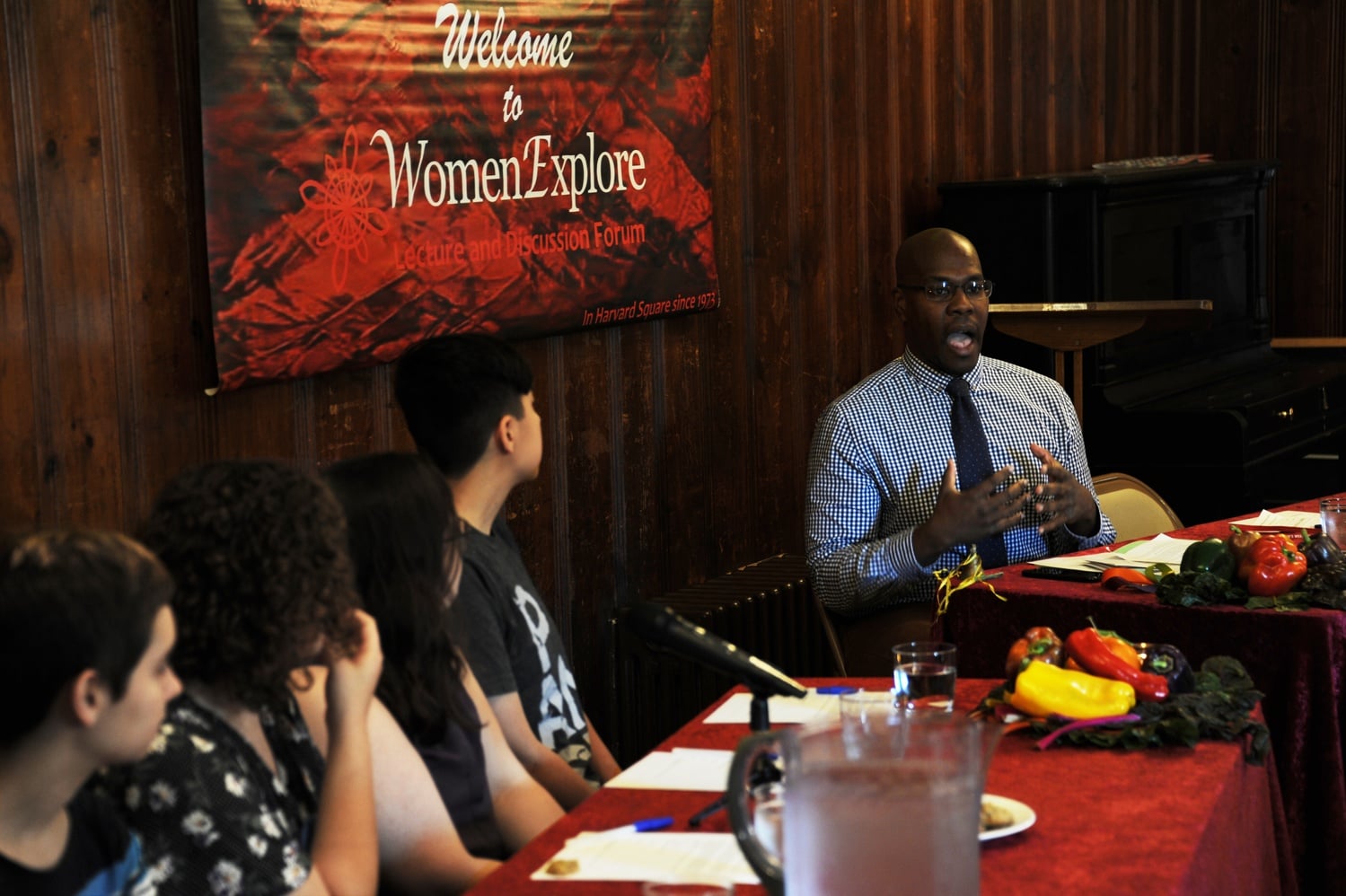Director of BGLTQ Student Life Sheehan D. Scarborough '07, right, introduces a panel of speakers at the Democracy center Thursday. Scarborough indicated at the event that the College is reviewing a policy that bars freshmen from living in gender-neutral housing.