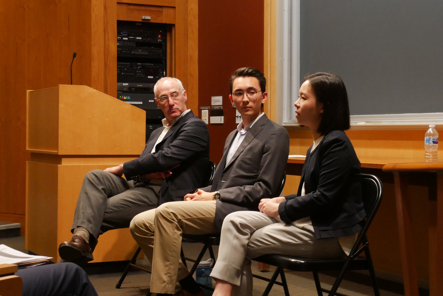 Brett Flehinger, the Secretary of the Honor Council, Jack W. Jue '18, and Margery W. Tong '17 speak at a town-hall meeting on the Honor Code.