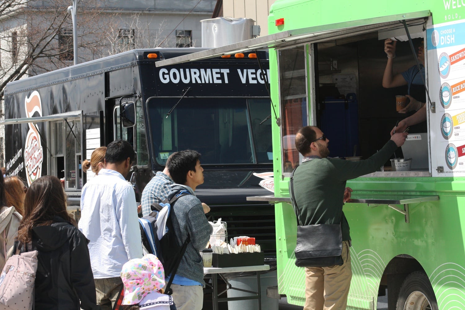 Food trucks gather on the Science Center Plaza daily. The Chicken and Rice Guys truck, a popular staple among students, will not appear at the plaza this fall.