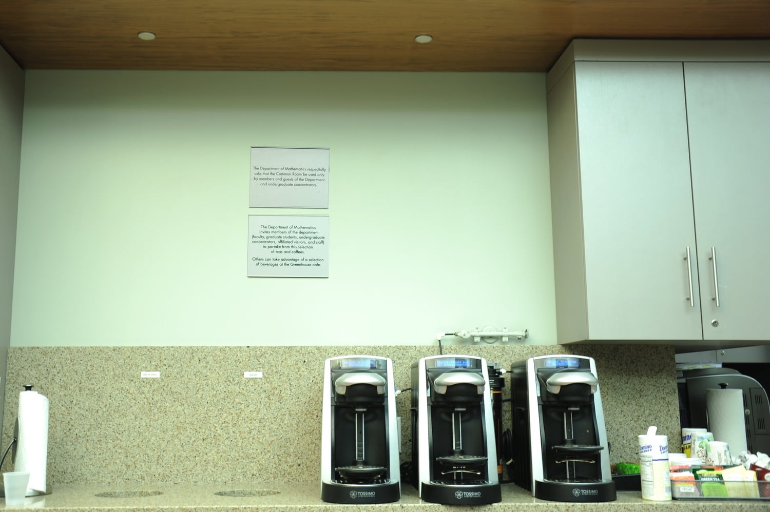 Two plaques hang on the wall of the math common room. Administrators installed the plaques after undergraduates complained department staffers disproportionately removed women from the lounge.