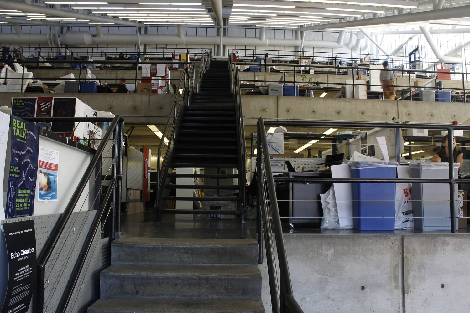 Gund Hall places different departments on distinct levels but in one large open space. 