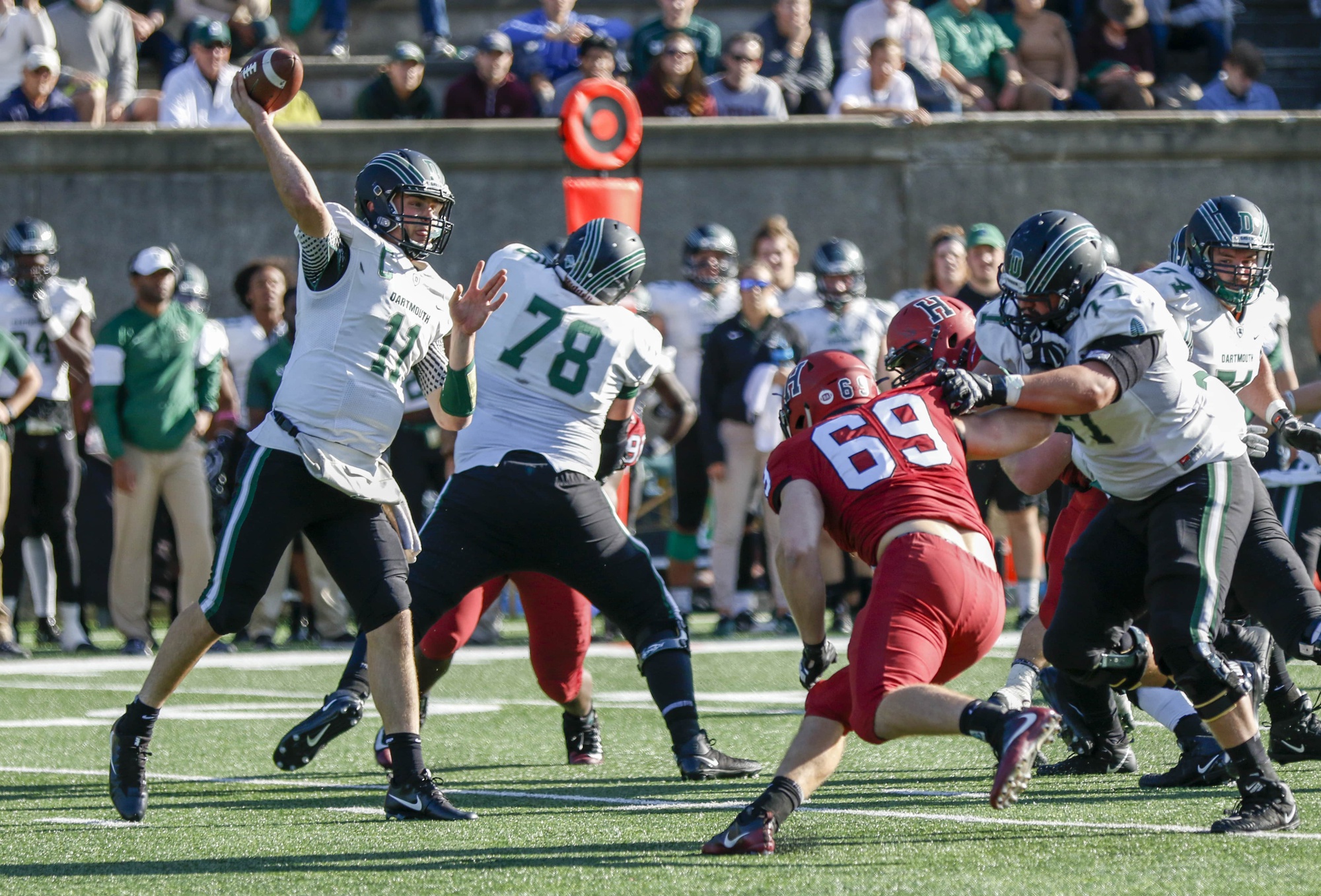 Dartmouth quarterback Jack Heneghan rears back for a throw against the Crimson.
