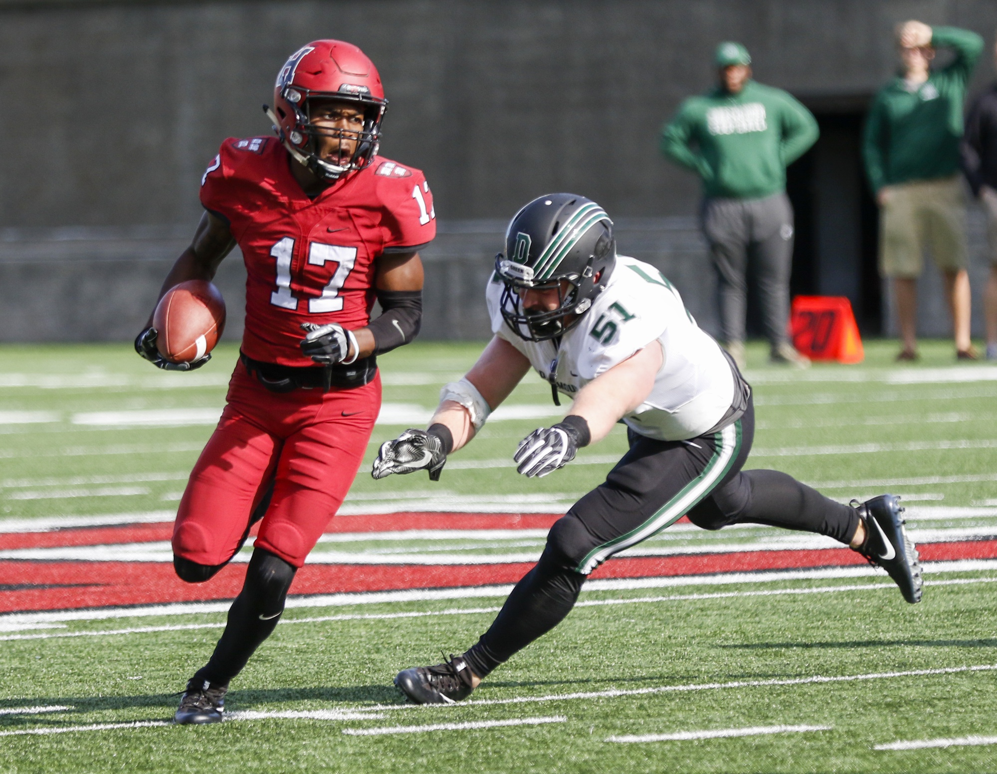 Junior running back Justice Shelton-Mosley skirts around a Dartmouth defender.