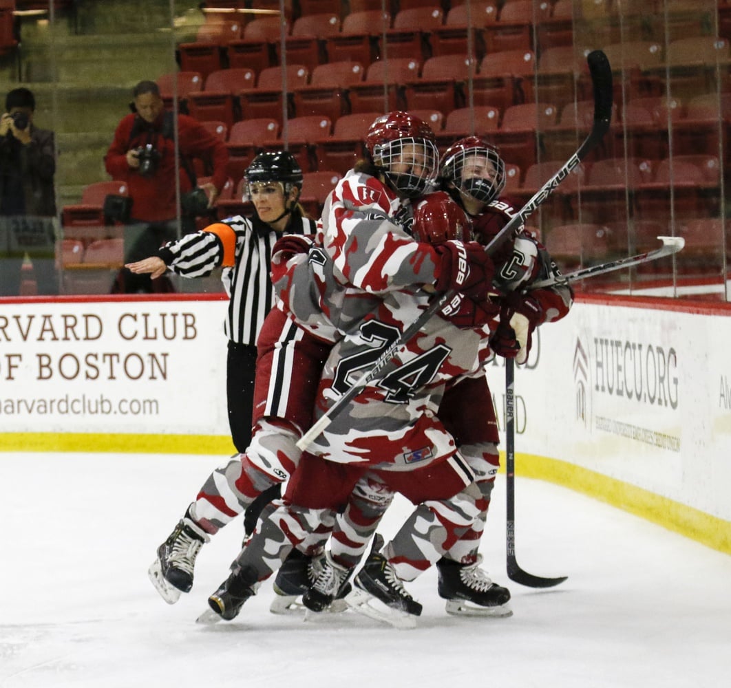 Crimson players celebrate after a goal in an early win against Dartmouth.