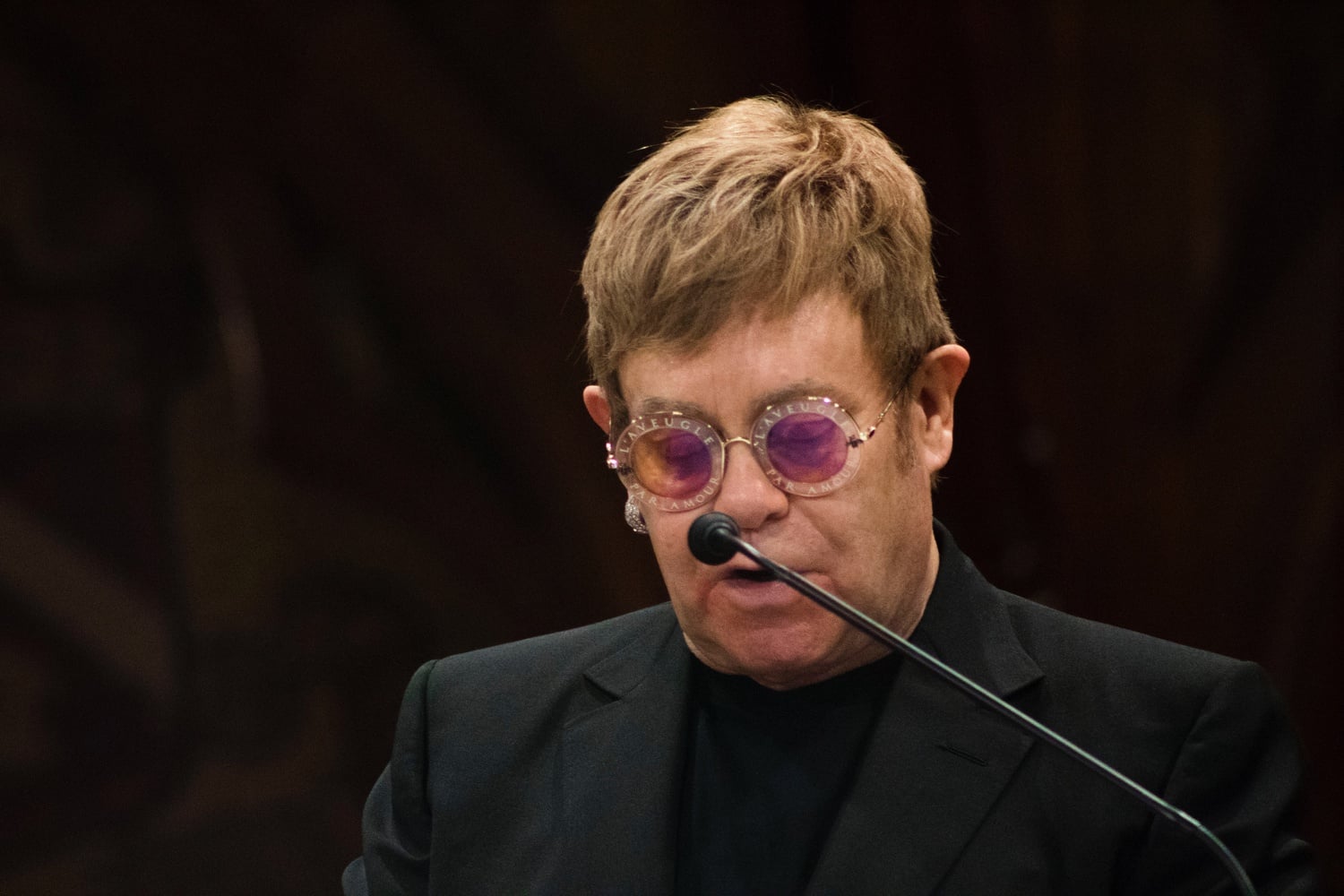 Sir Elton H. John accepts the Harvard Humanitarian of the Year award for his work addressing the global AIDS epidemic. 