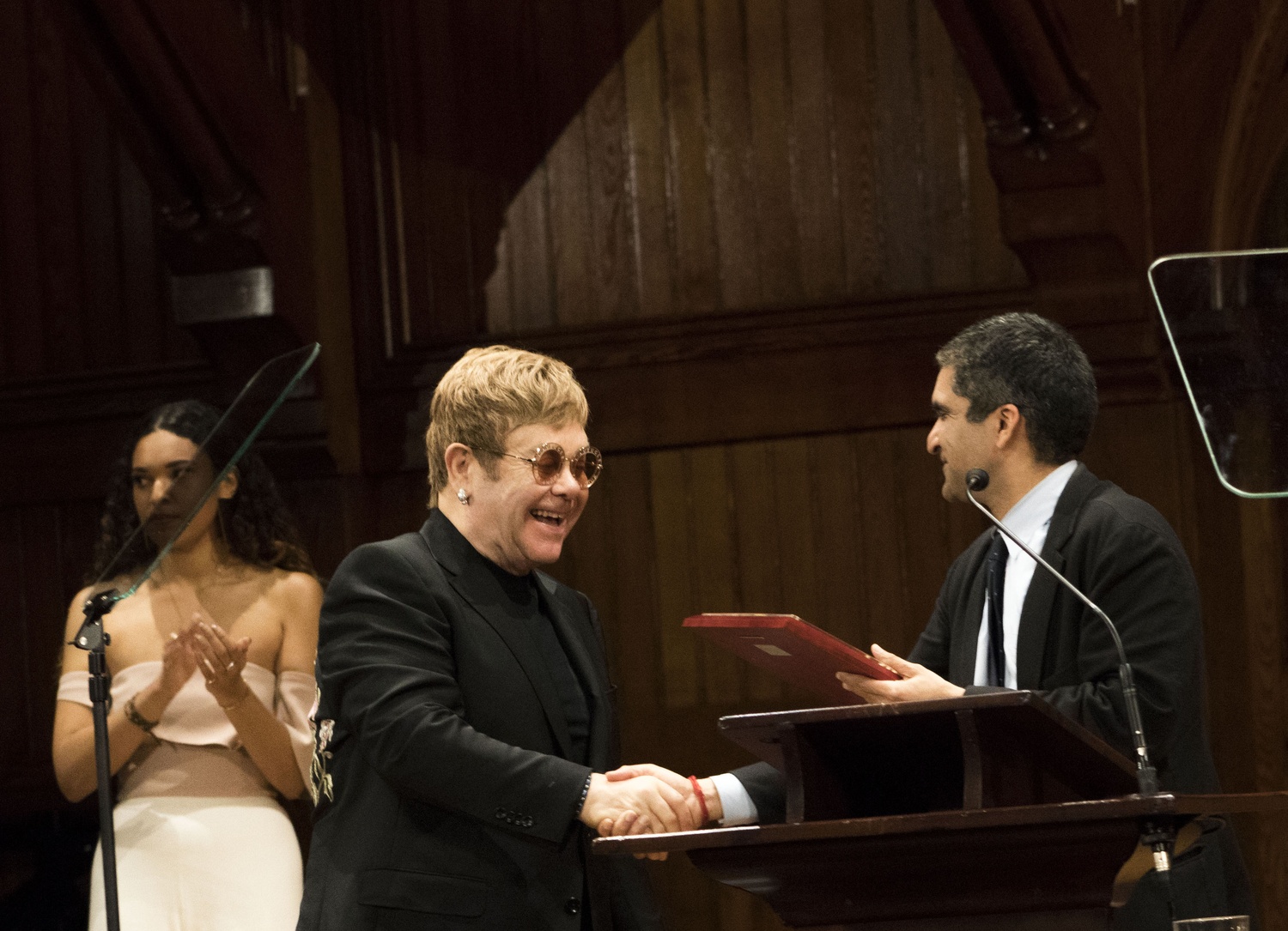 Sir Elton H. John accepts the Harvard Humanitarian of the Year award for his work addressing the global AIDS epidemic. 