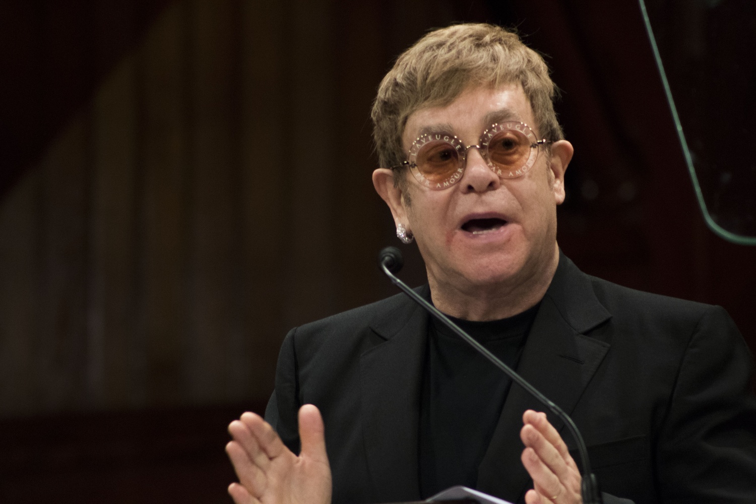 Sir Elton H. John accepts the Harvard Humanitarian of the Year award for his work addressing the global AIDS epidemic. 