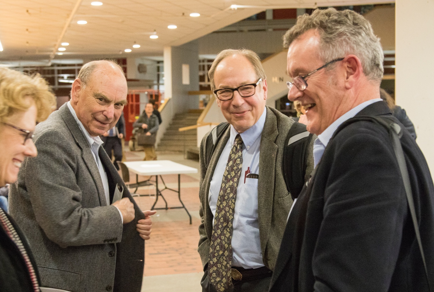Former Dean of the College Harry R. Lewis '68, center right, talks with colleagues after Tuesday's Faculty meeting. The Faculty of Arts and Sciences voted down Lewis's motion, 130-90.