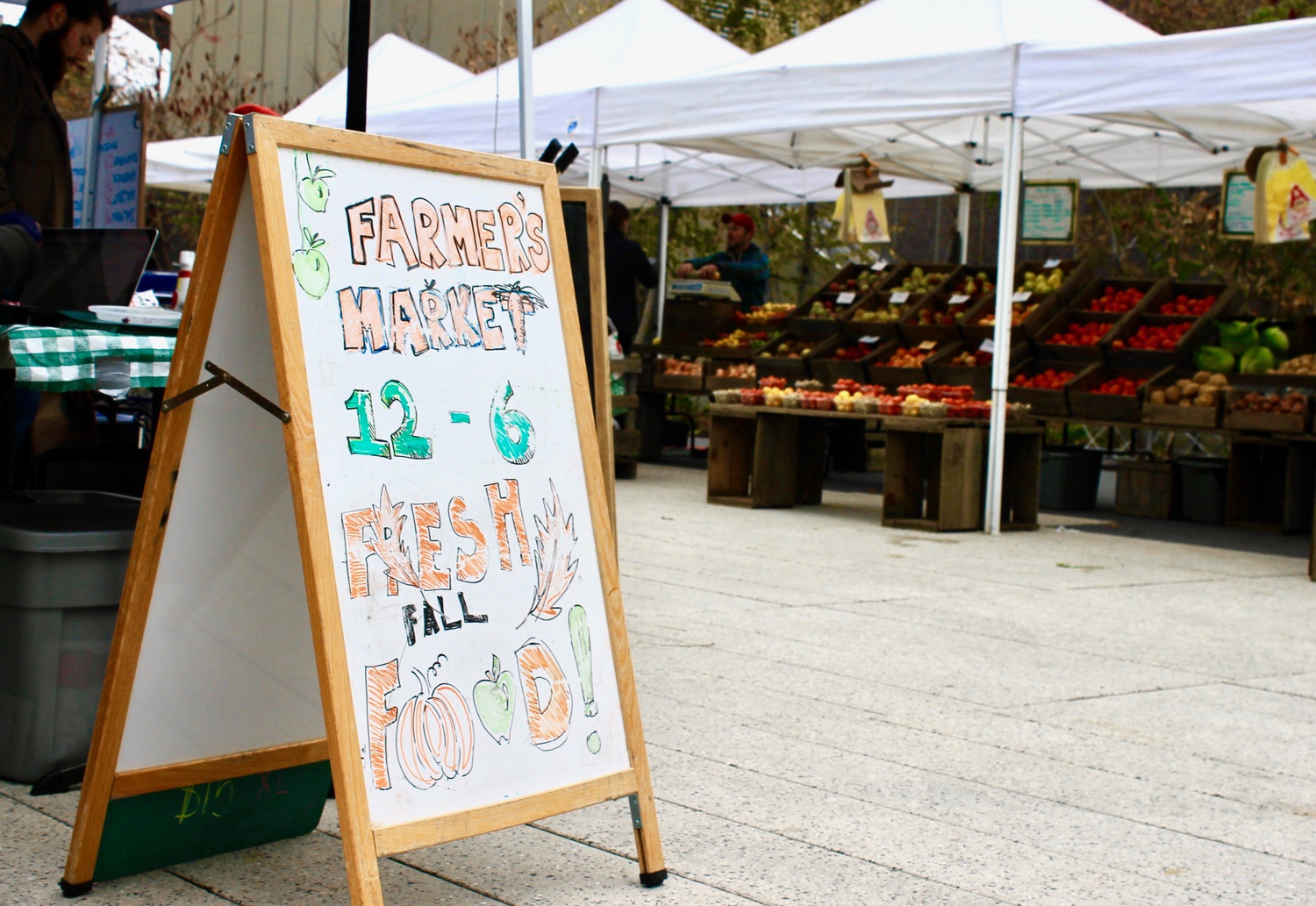 Local vendors sell food at the weekly Farmers’ Market in the Science Center Plaza on Tuesday.