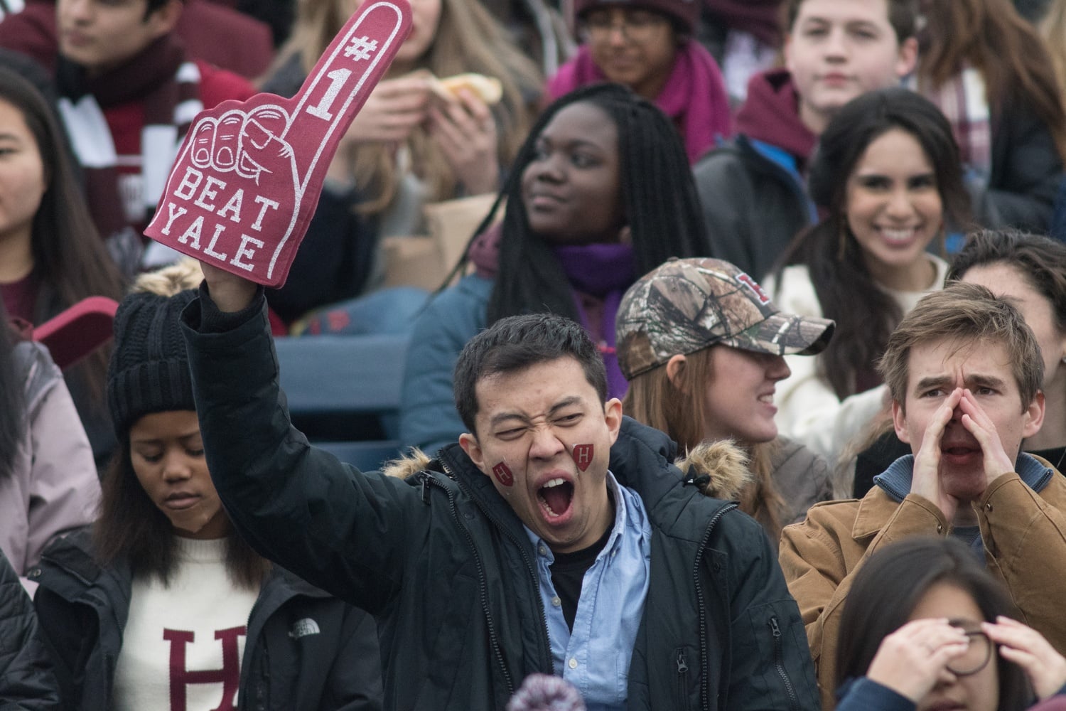 Andrew B. Jing '19 yawns as Luke T. Kramer '19 cheers beside him.