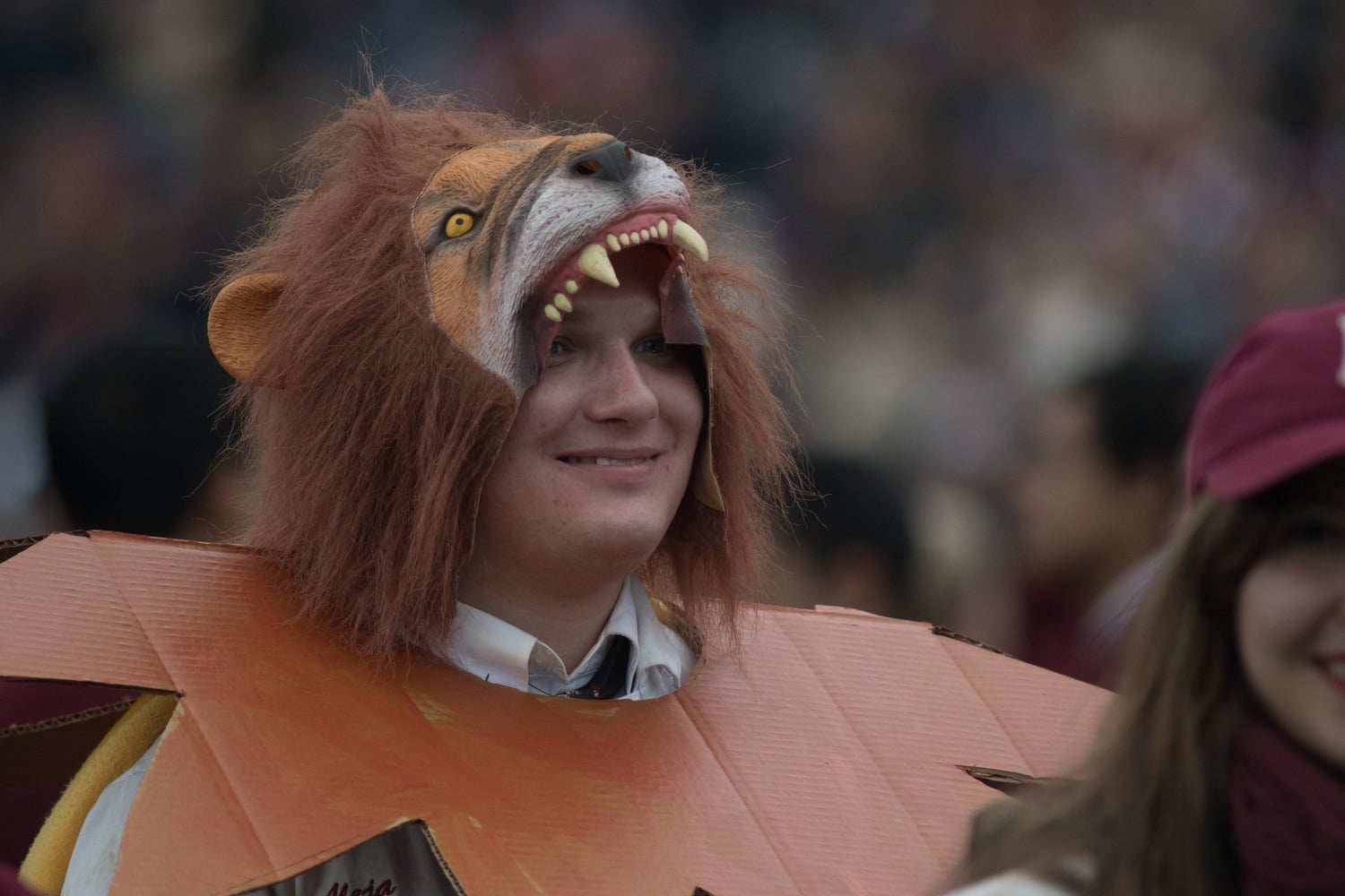 Alex G. Cox '16, an alumnus of the Band, dresses up as a lion for the half-time show.