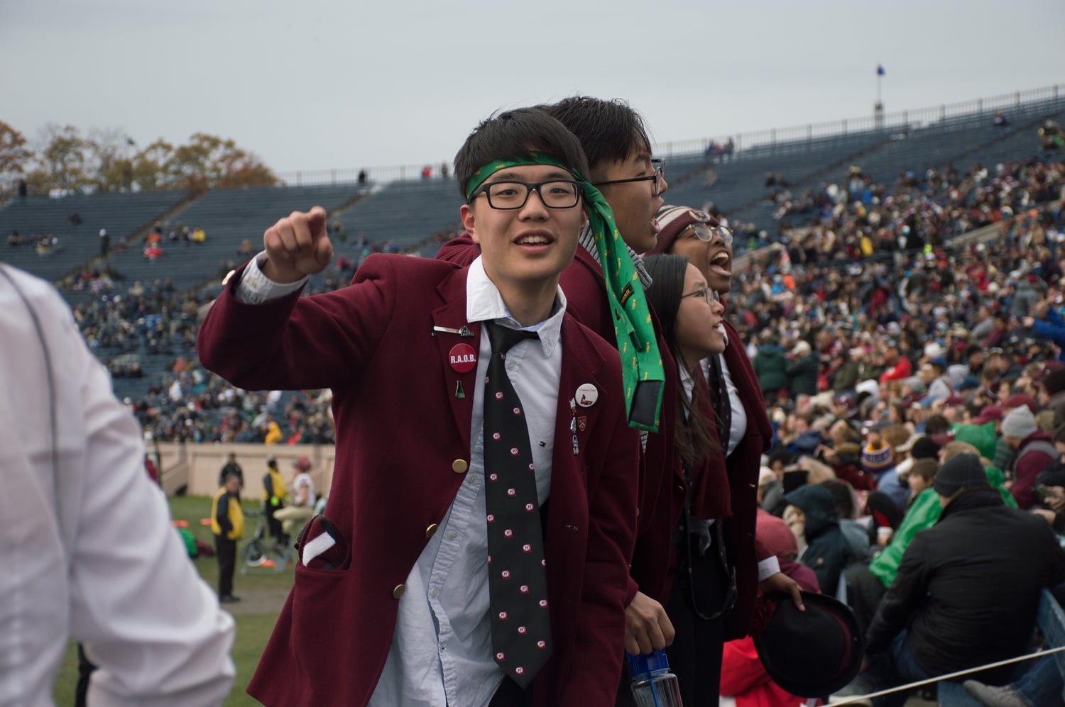 Brandon J. Kim '19 cheers with the Harvard University Band.